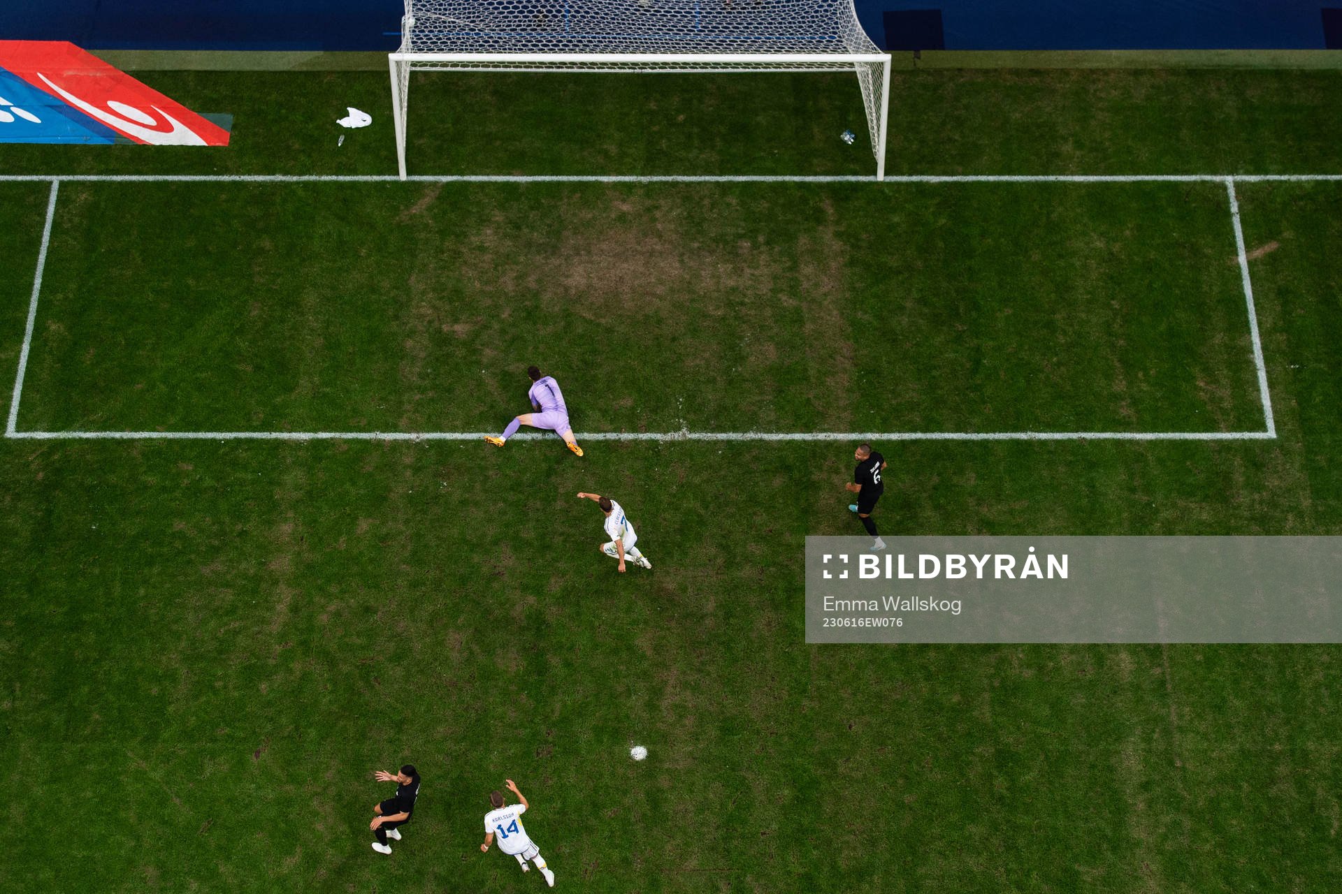 Jesper Karlsson of Sweden scores 1-1 behind goalkeeper Oli