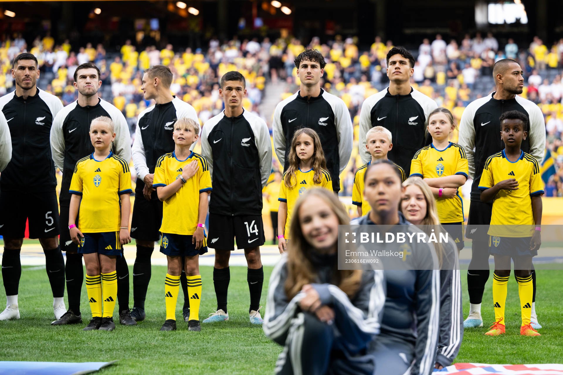 Mascots infront of players of New Zealand