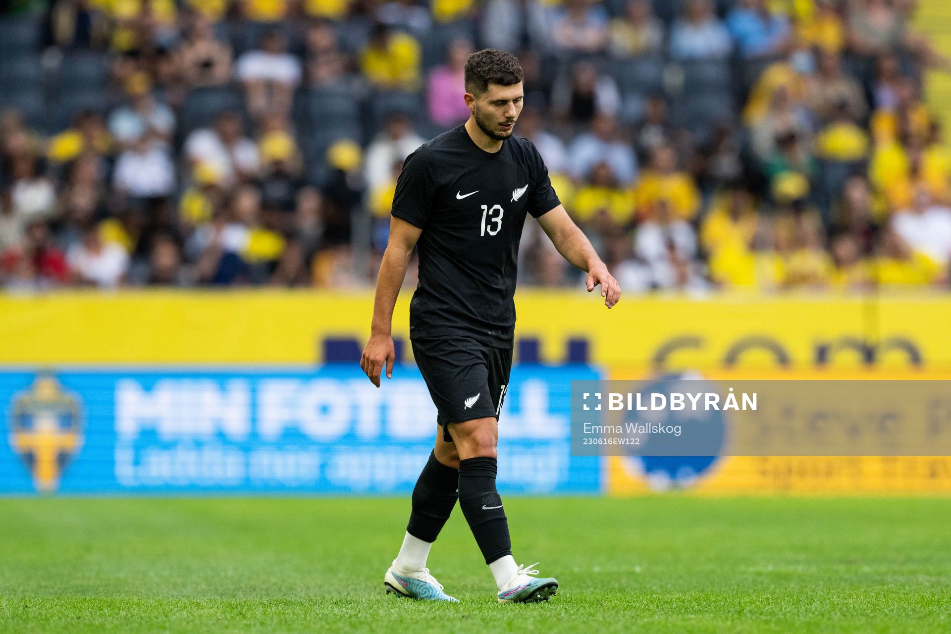 Liberato Cacace of New Zealand looks dejected