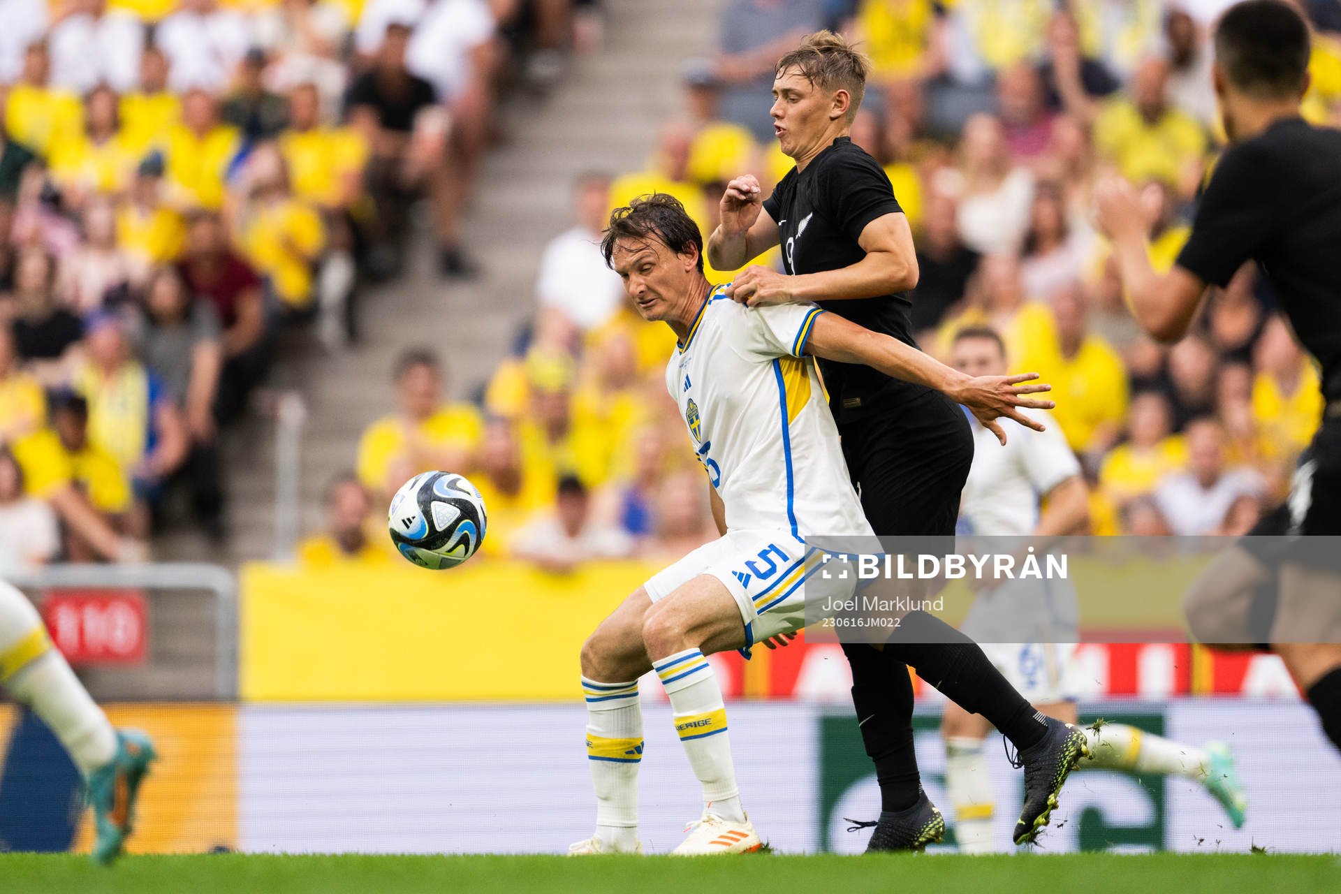 Hjalmar Ekdal of Sweden and Ben Waine of New Zealand during the international friendly football match between Sweden and New Zealand on June 16, 2023 in Stockholm.