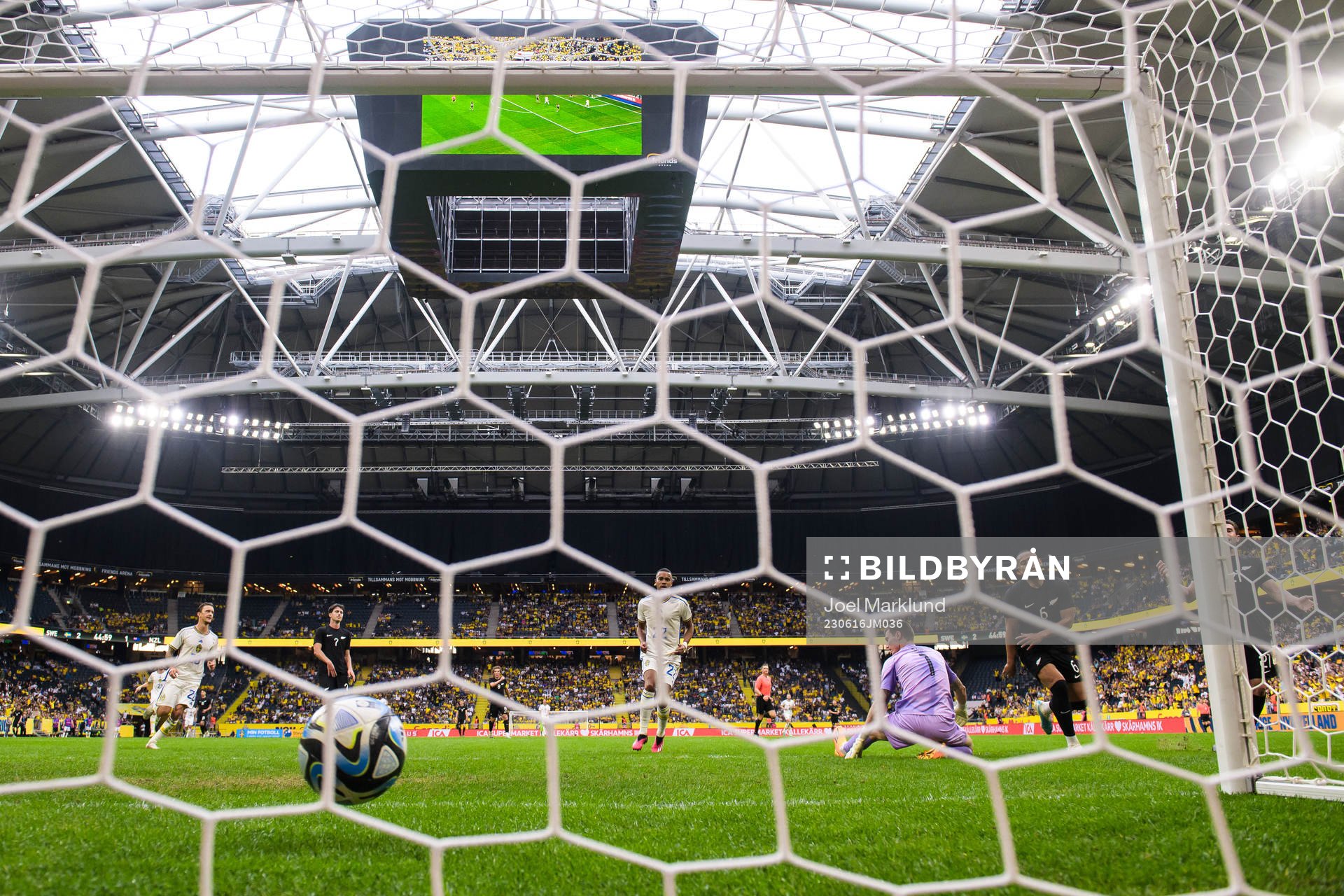 Robin Quaison of Sweden scores 2-1 behind goalkeeper Oli