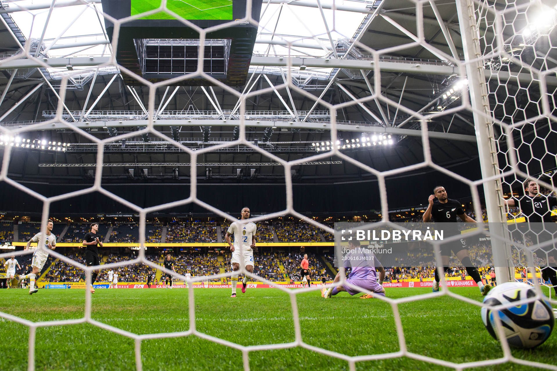 Robin Quaison of Sweden scores 2-1 behind goalkeeper Oli