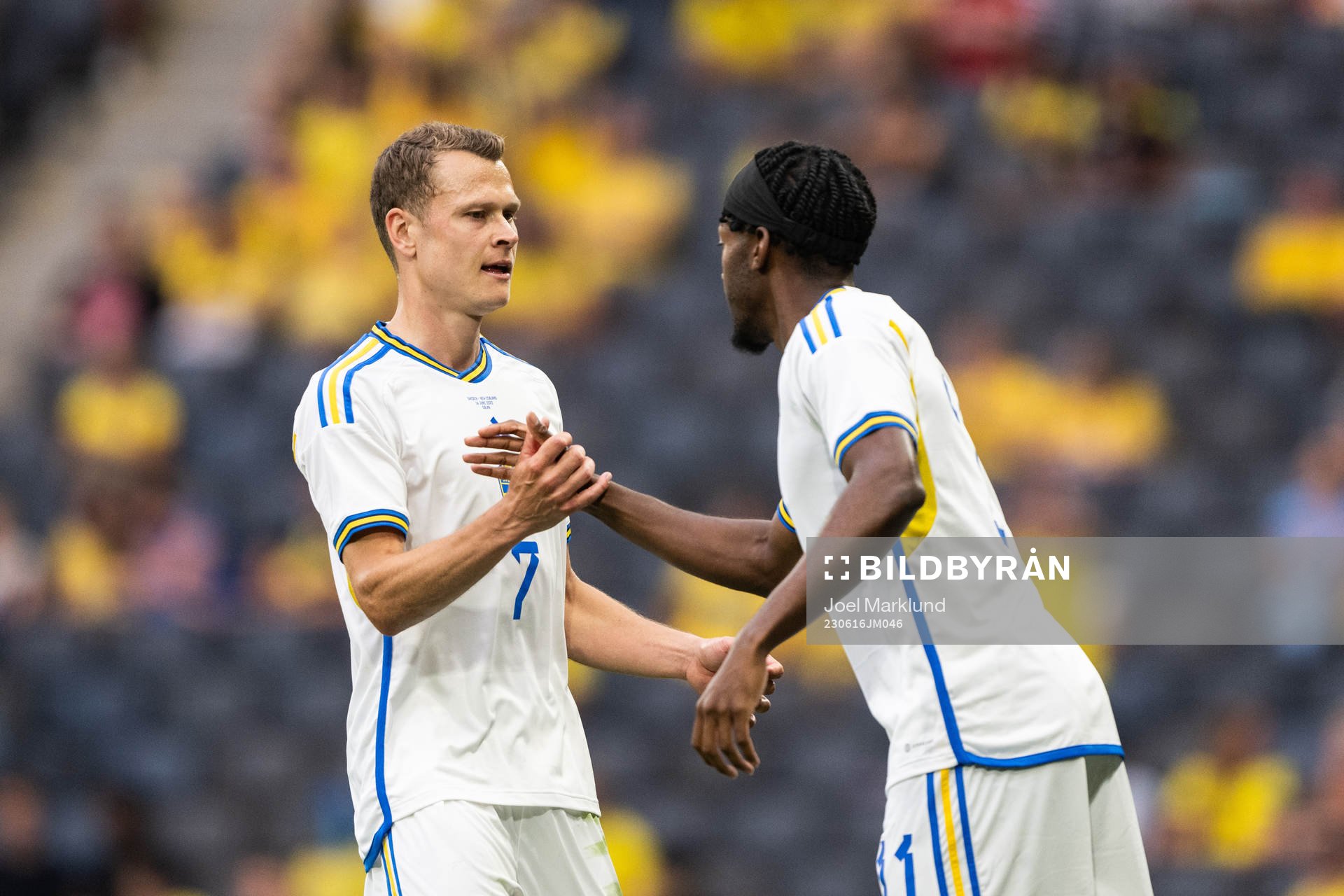 Viktor Claesson changes with Anthony Elanga of Sweden