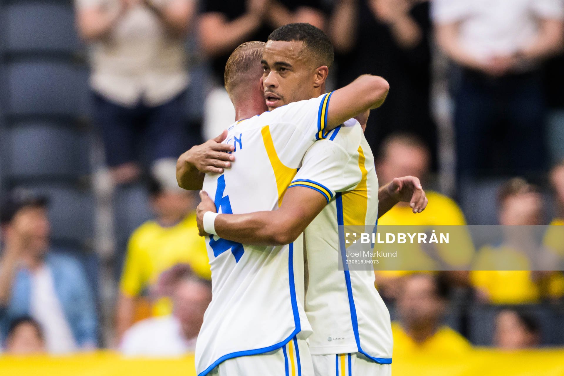 Daniel Sundgren and Robin Quaison of Sweden celebrate the