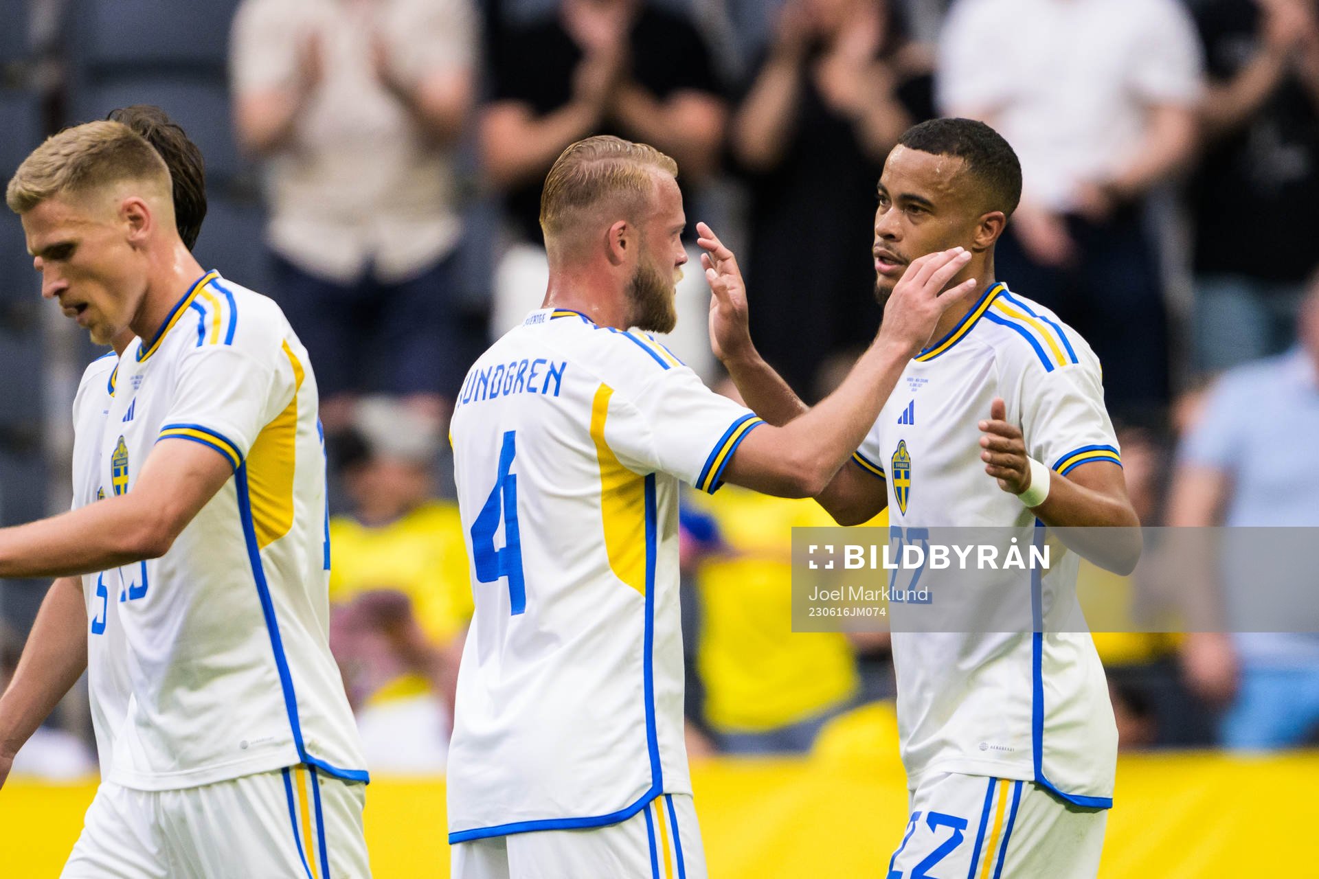 Daniel Sundgren and Robin Quaison of Sweden celebrate the