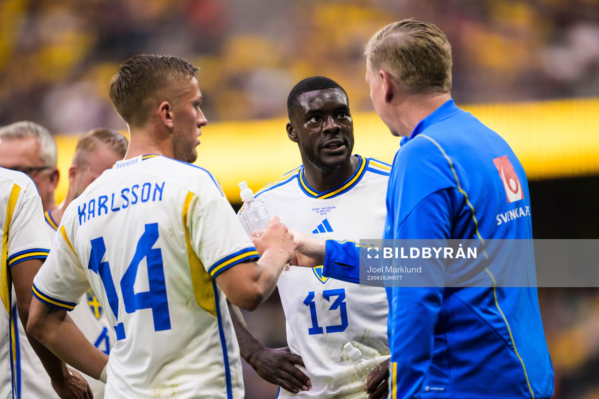 Jesper Karlsson and Ken Sema get instructions from