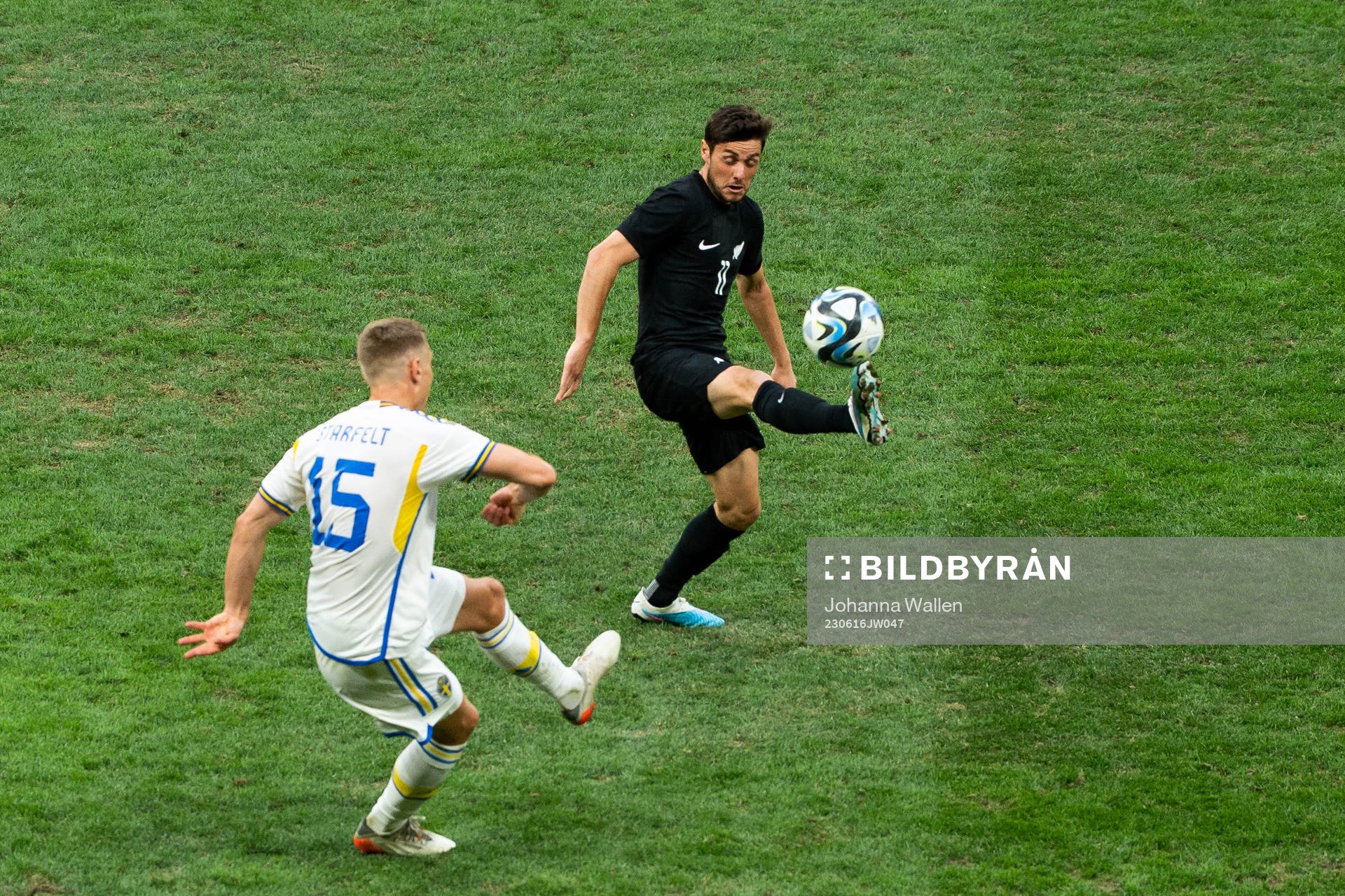 Carl Starfelt of Sweden and Marco Rojas of New Zealand