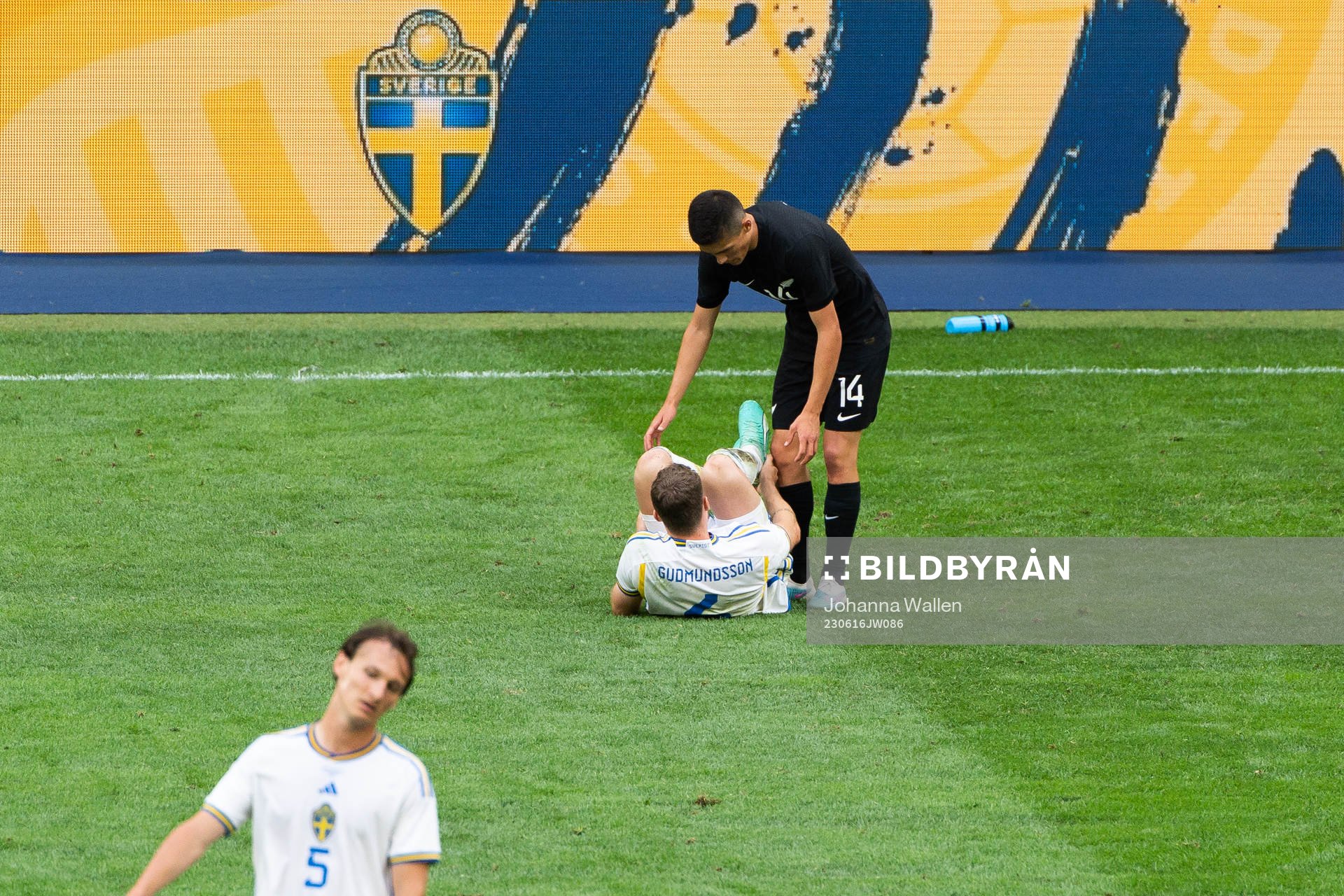 Gabriel Gudmundsson of Sweden in pain and Elijah Just of