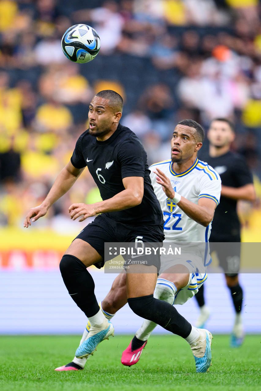 Bill Tuiloma of New Zealand and Robin Quaison of Sweden