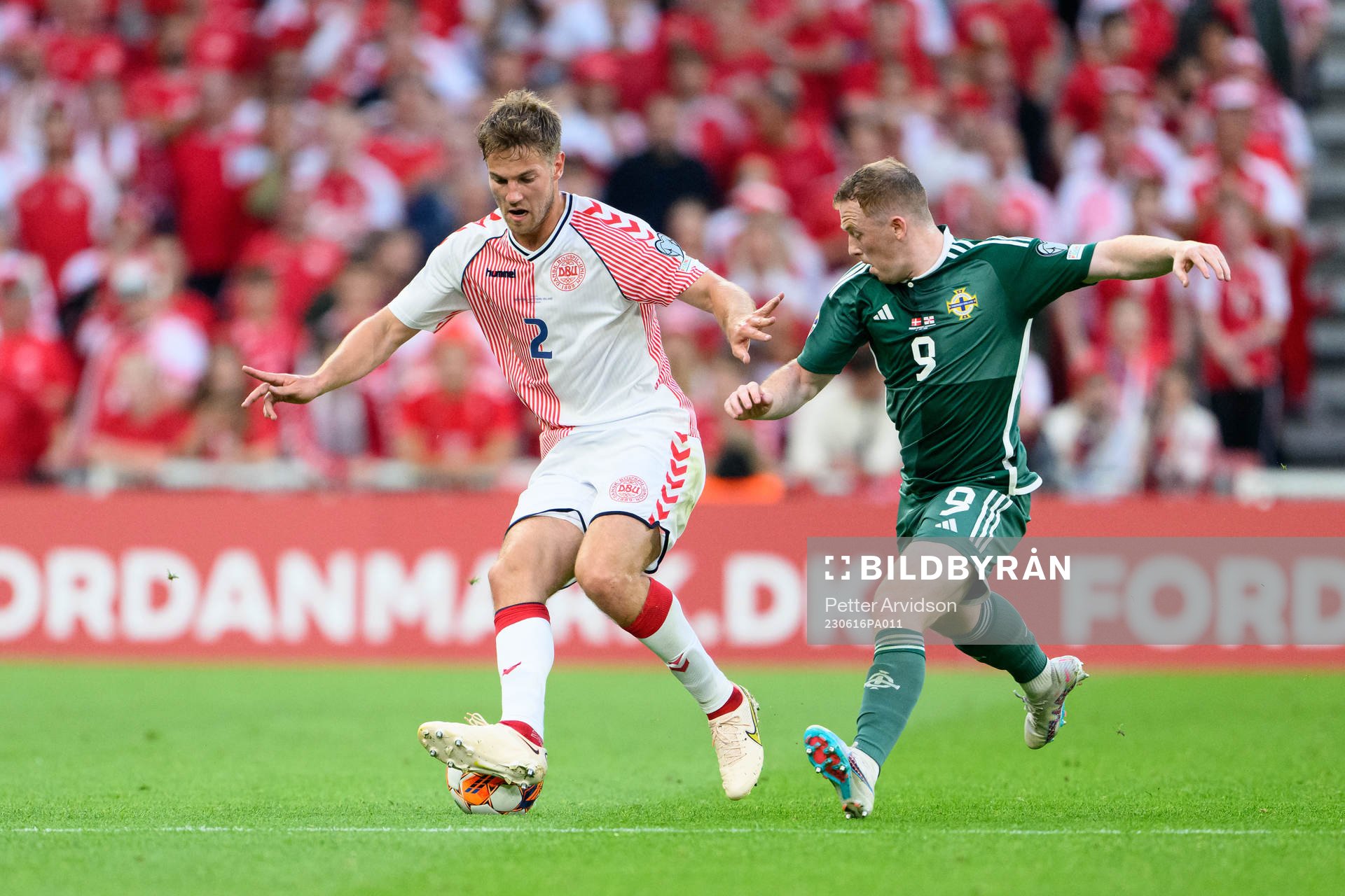 Joachim Andersen of Denmark and Shayne Lavery of Northern