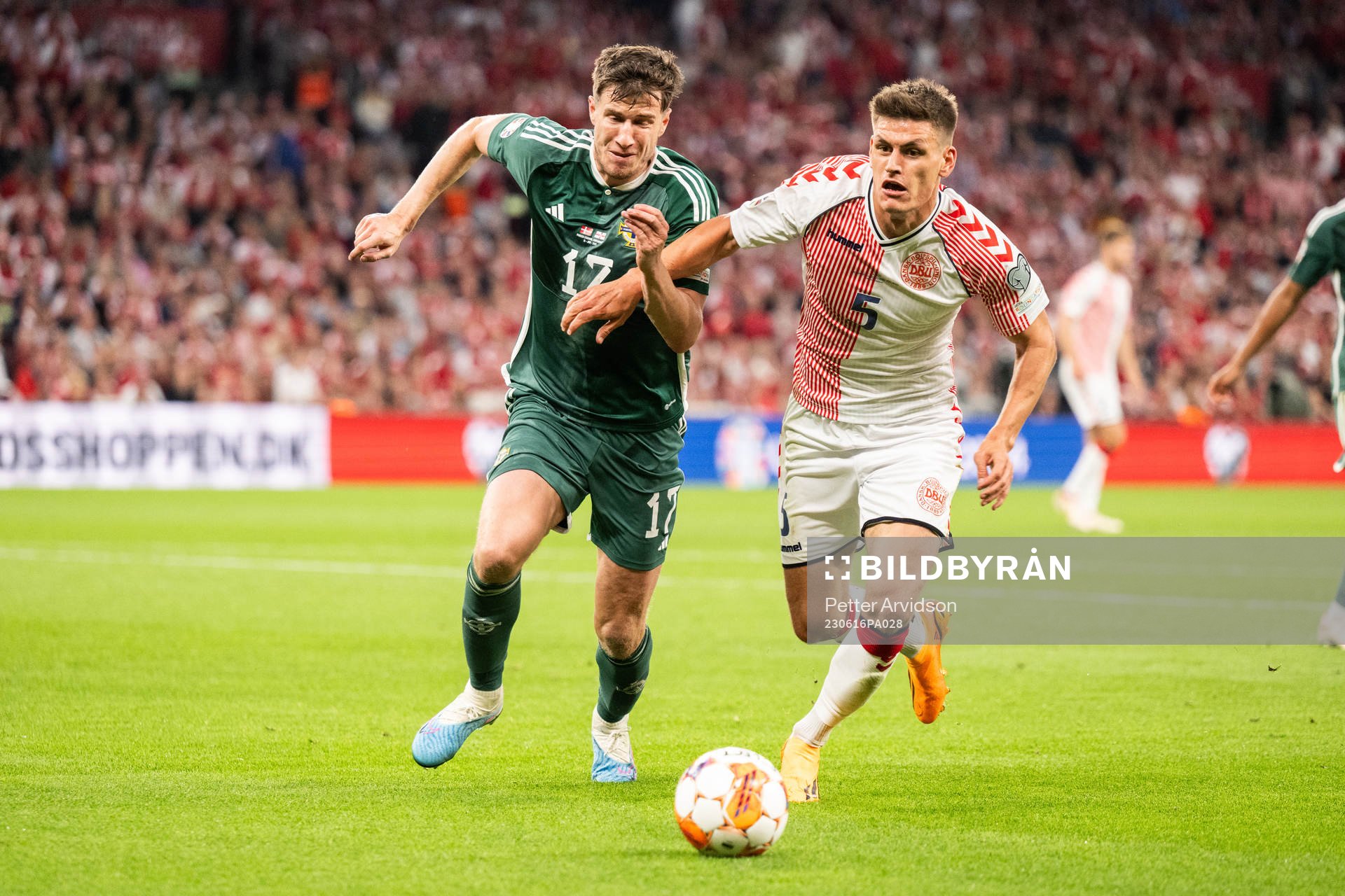 Paddy McNair of Northern Ireland and Joakim Mæhle of