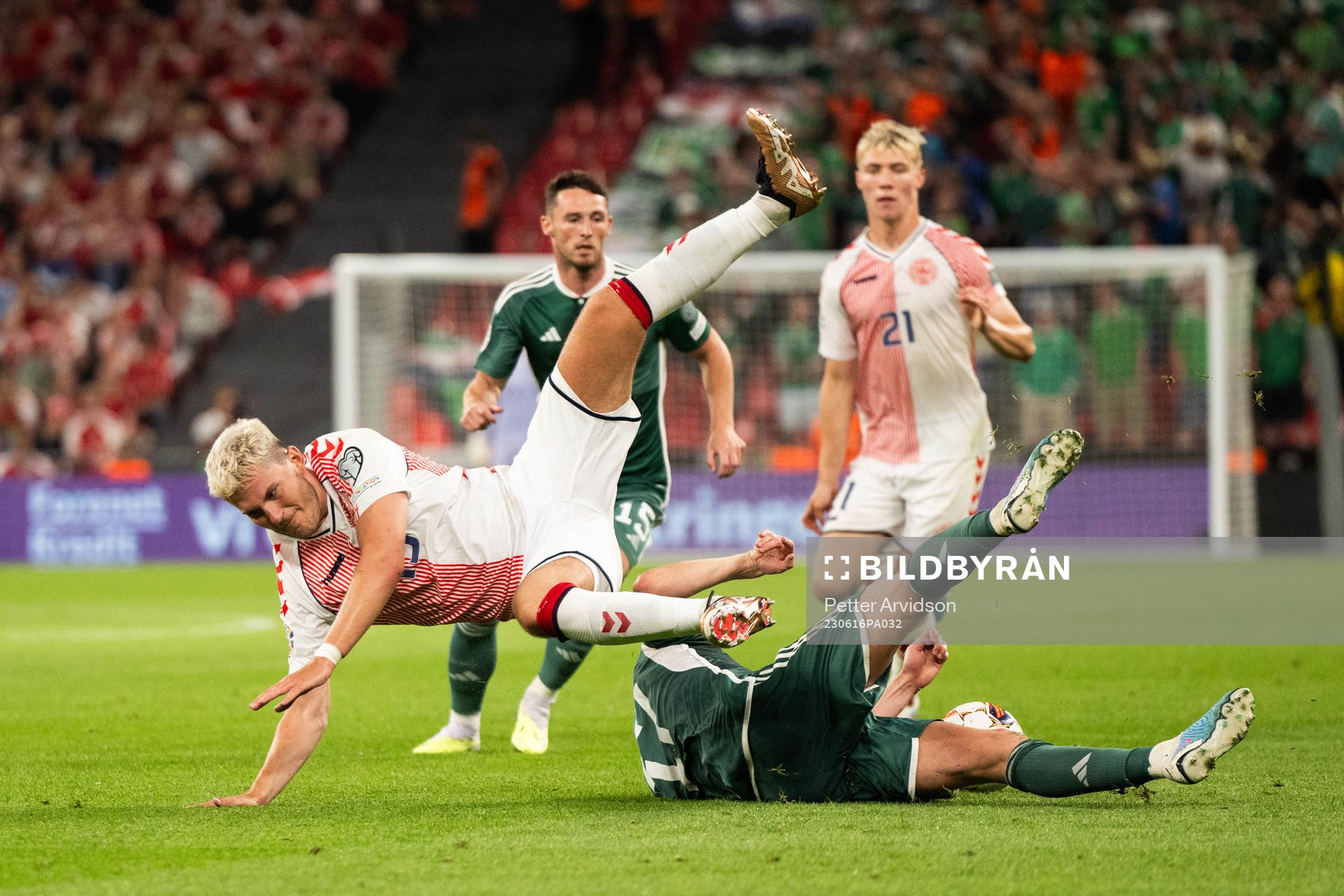Jonas Wind of Denmark and Paddy McNair of Northern Ireland