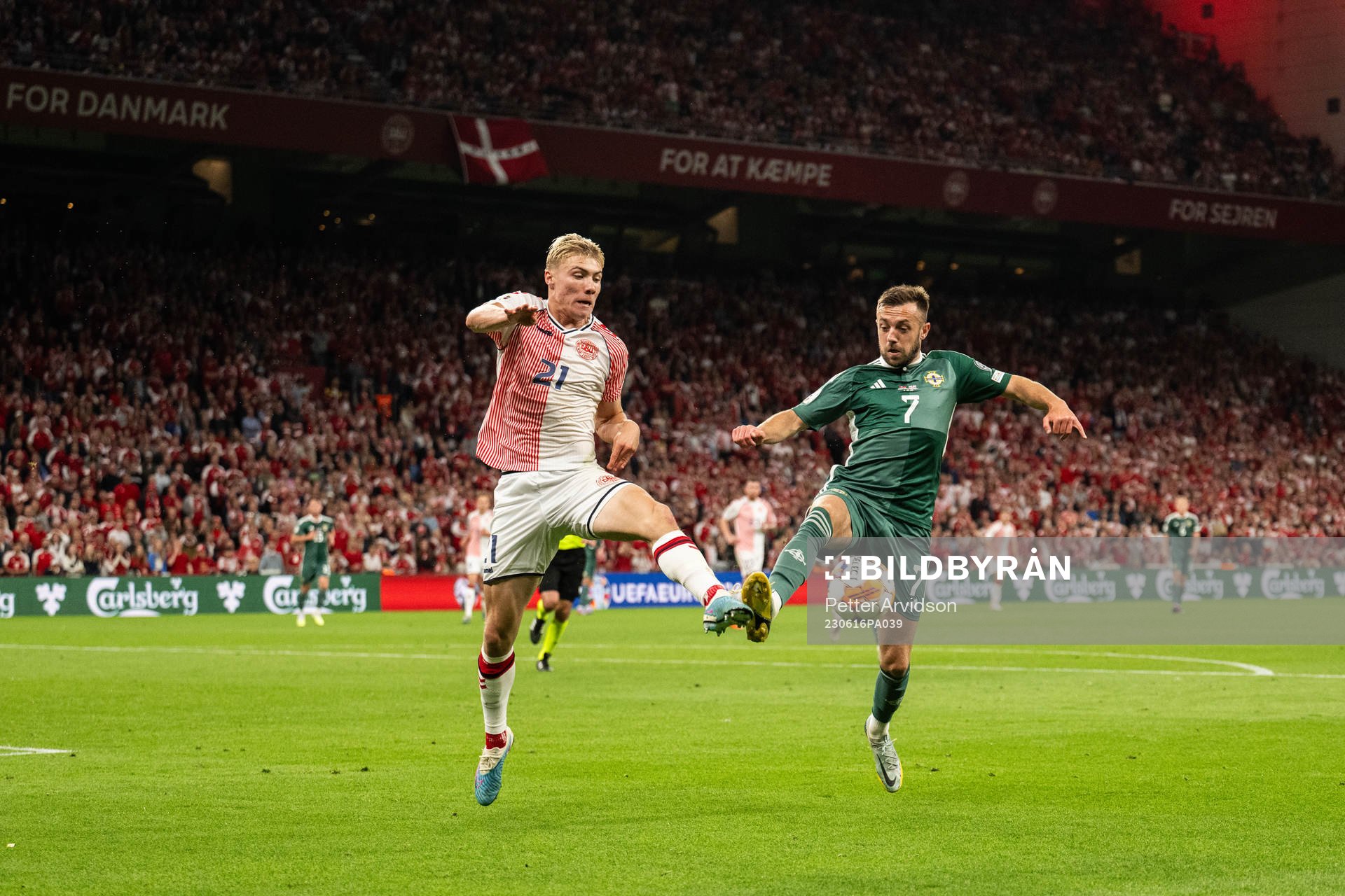 Rasmus Højlund of Denmark and Conor McMenamin of Northern