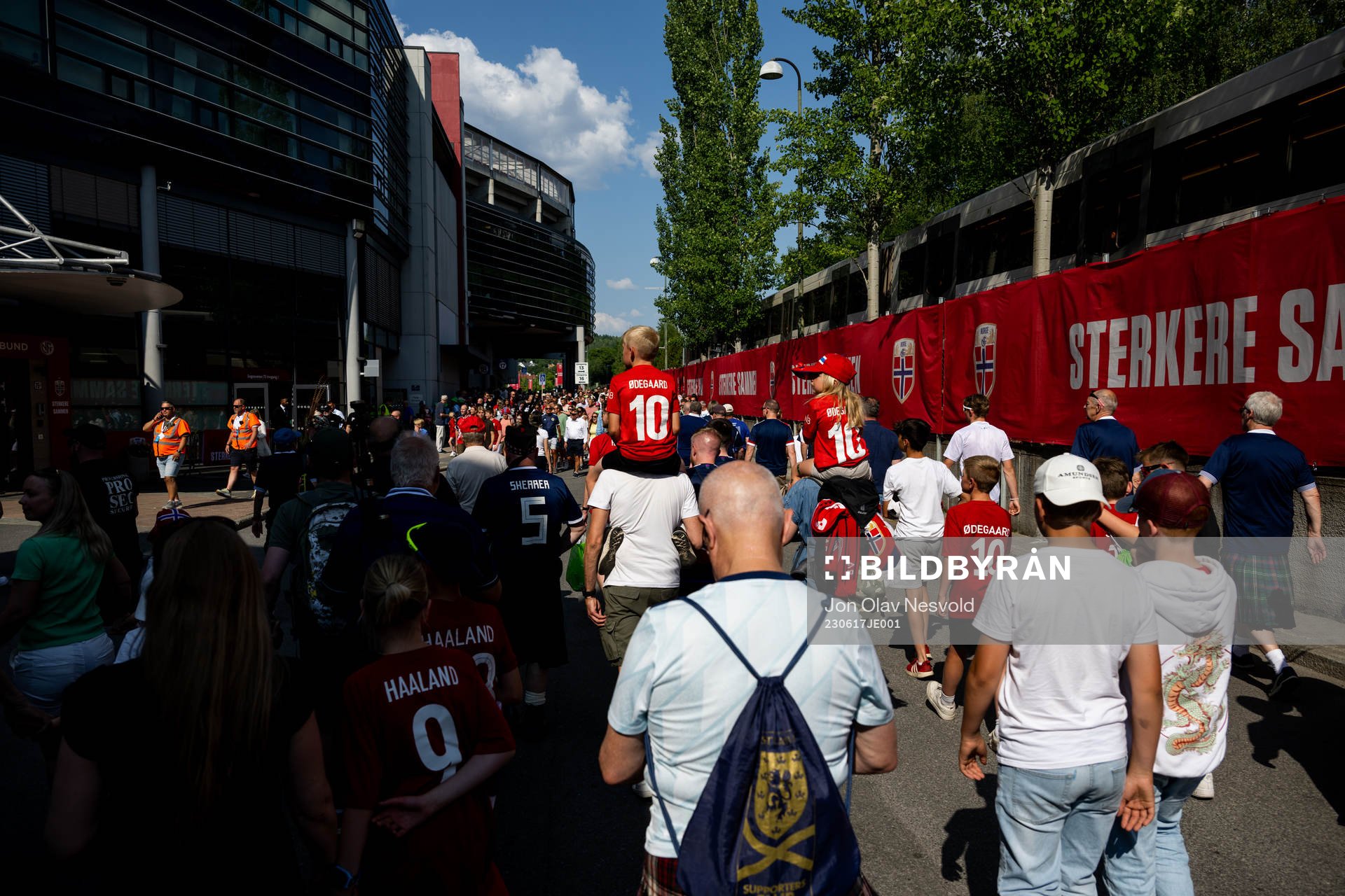 Supporters watch the team arrival