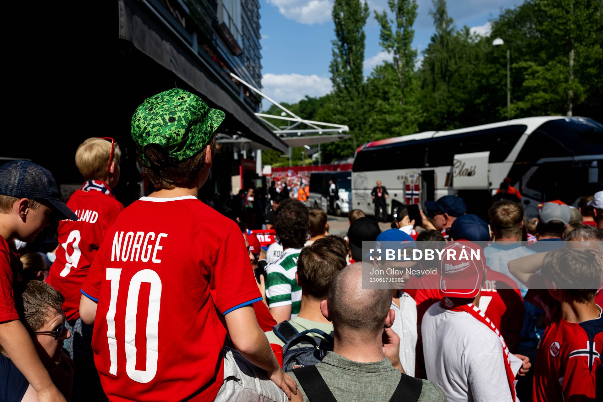 Supporters watch the team arrival