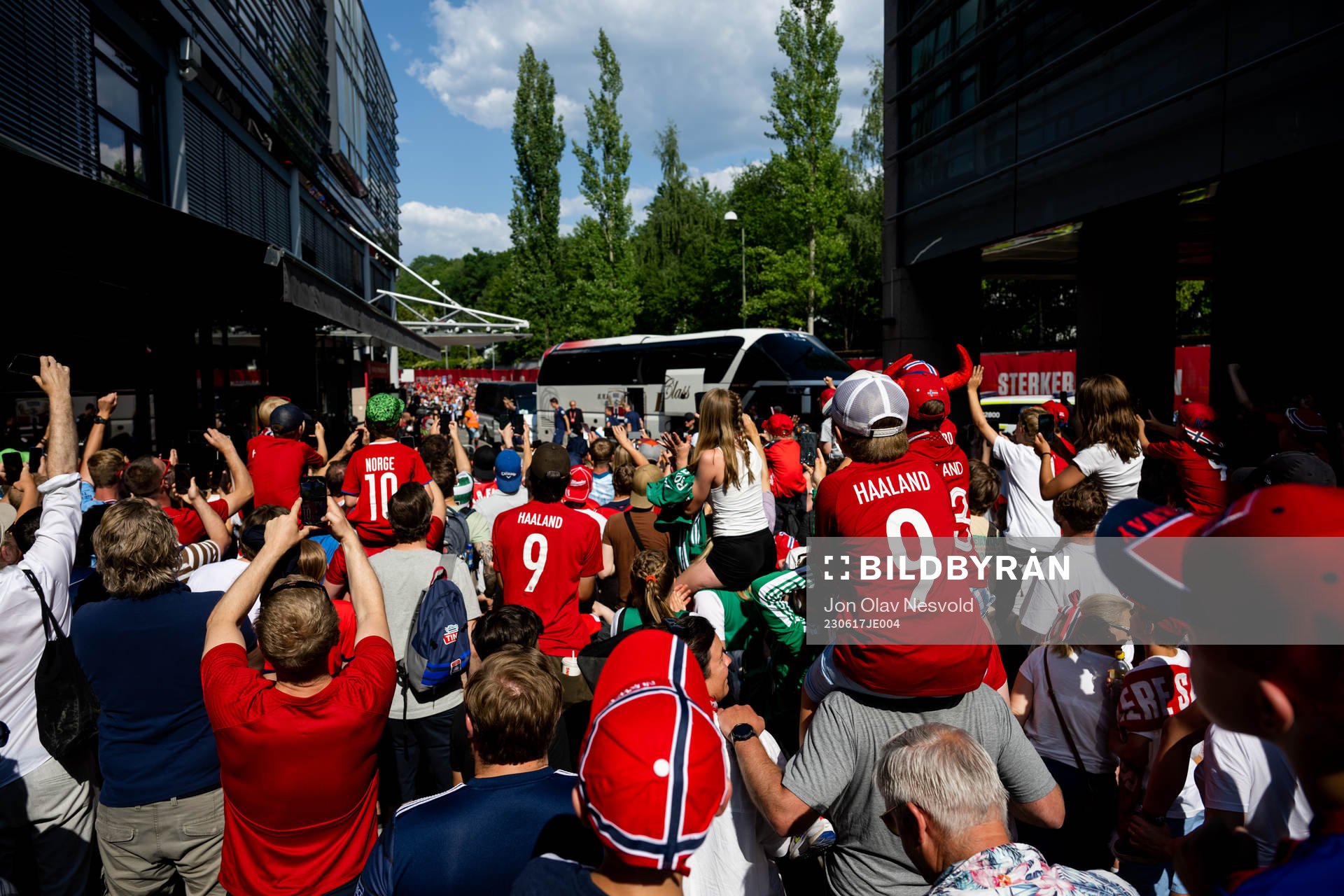 Supporters watch the team arrival