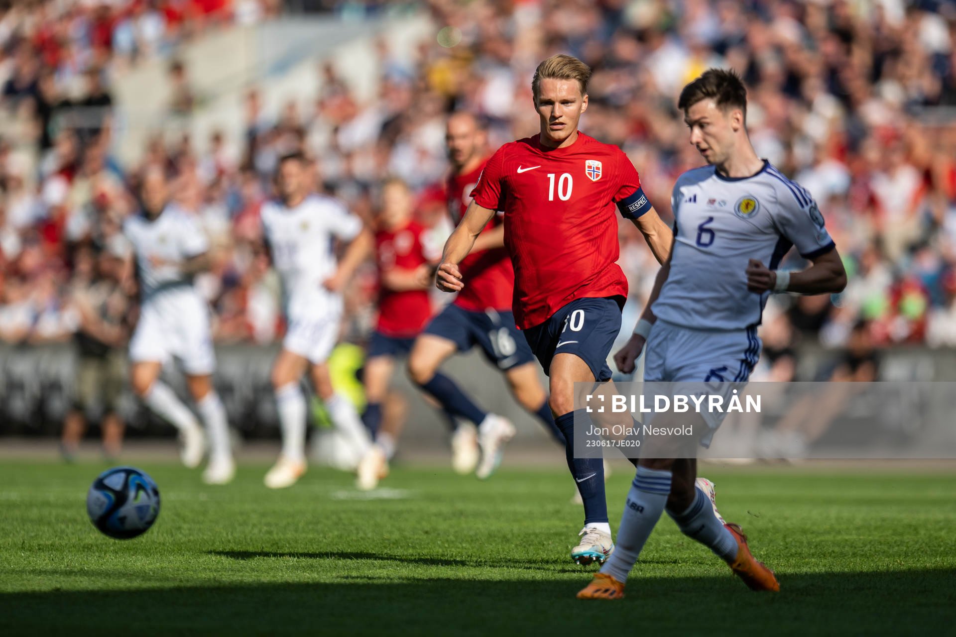 Martin Ødegaard of Norway and Kieran Tierney of Scotland