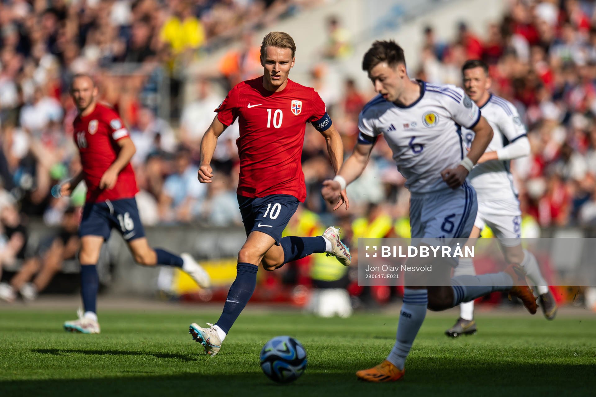 Martin Ødegaard of Norway and Kieran Tierney of Scotland