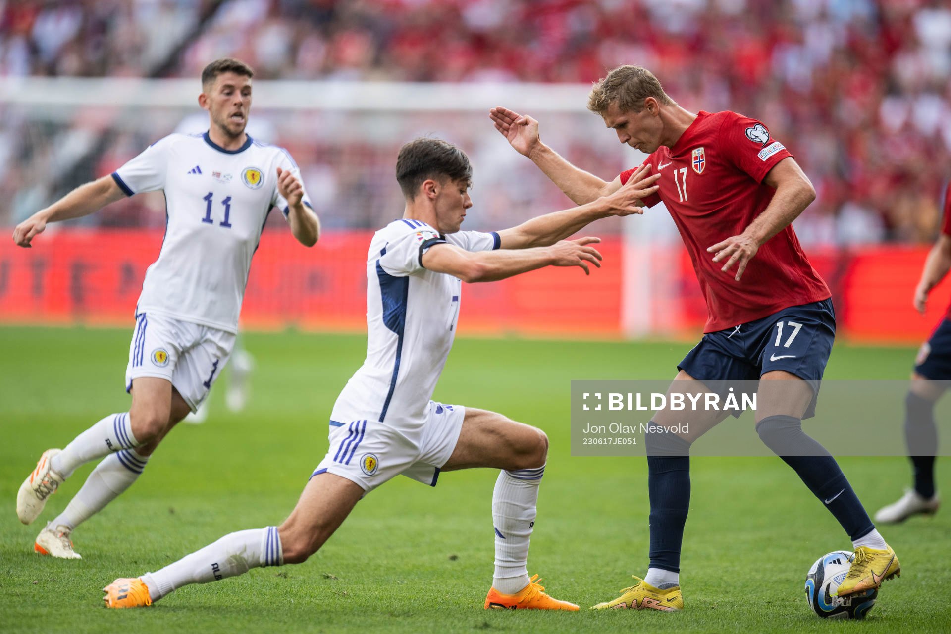 Aaron Hickey of Scotland and Ola Solbakken of Norway