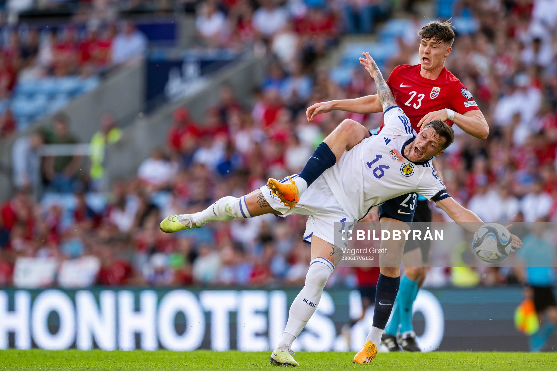 Liam Cooper of Scotland and Jørgen Strand Larsen of Norway