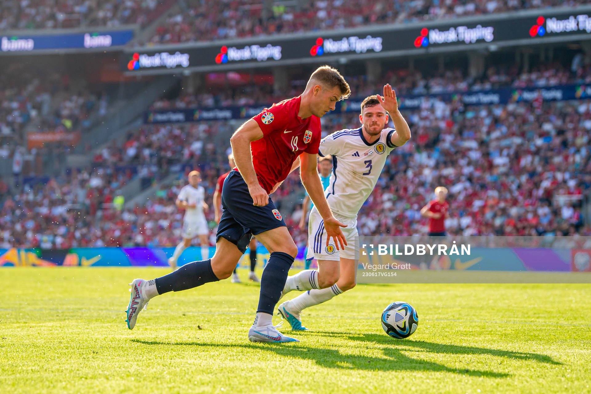 Alexander Sørloth of Norway and Andrew Robertson of
