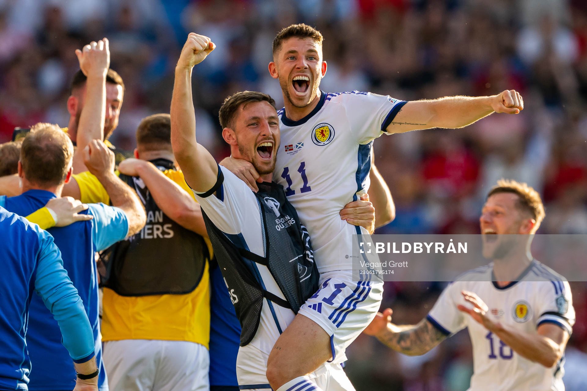 Ryan Christie and players of Scotland celebrate