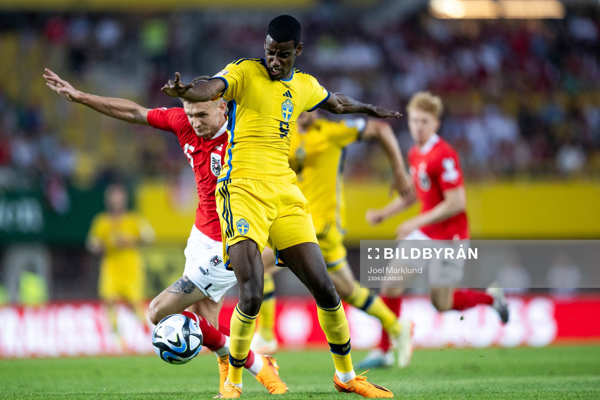 Stefan Posch of Austria and Alexander Isak of Sweden