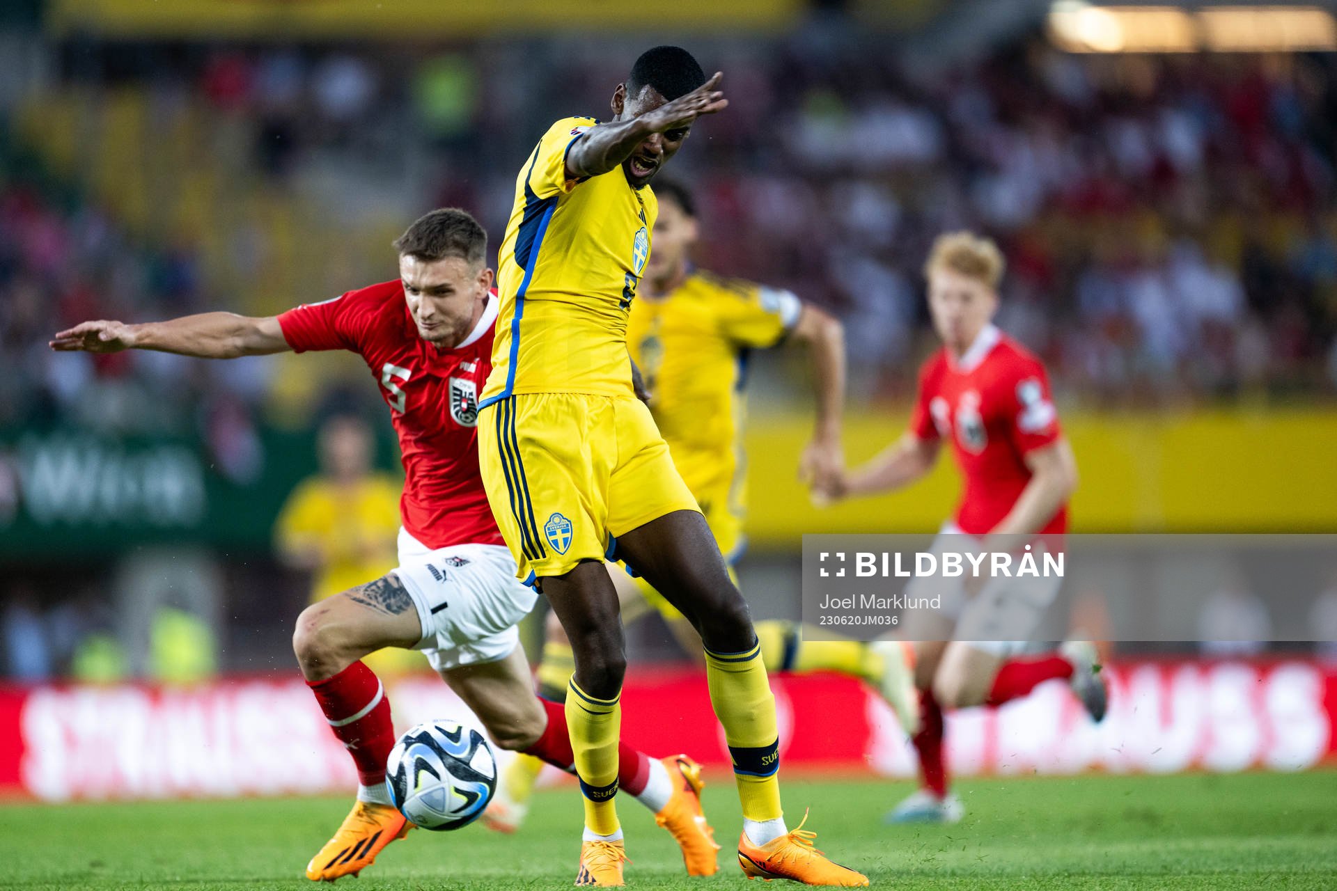 Stefan Posch of Austria and Alexander Isak of Sweden