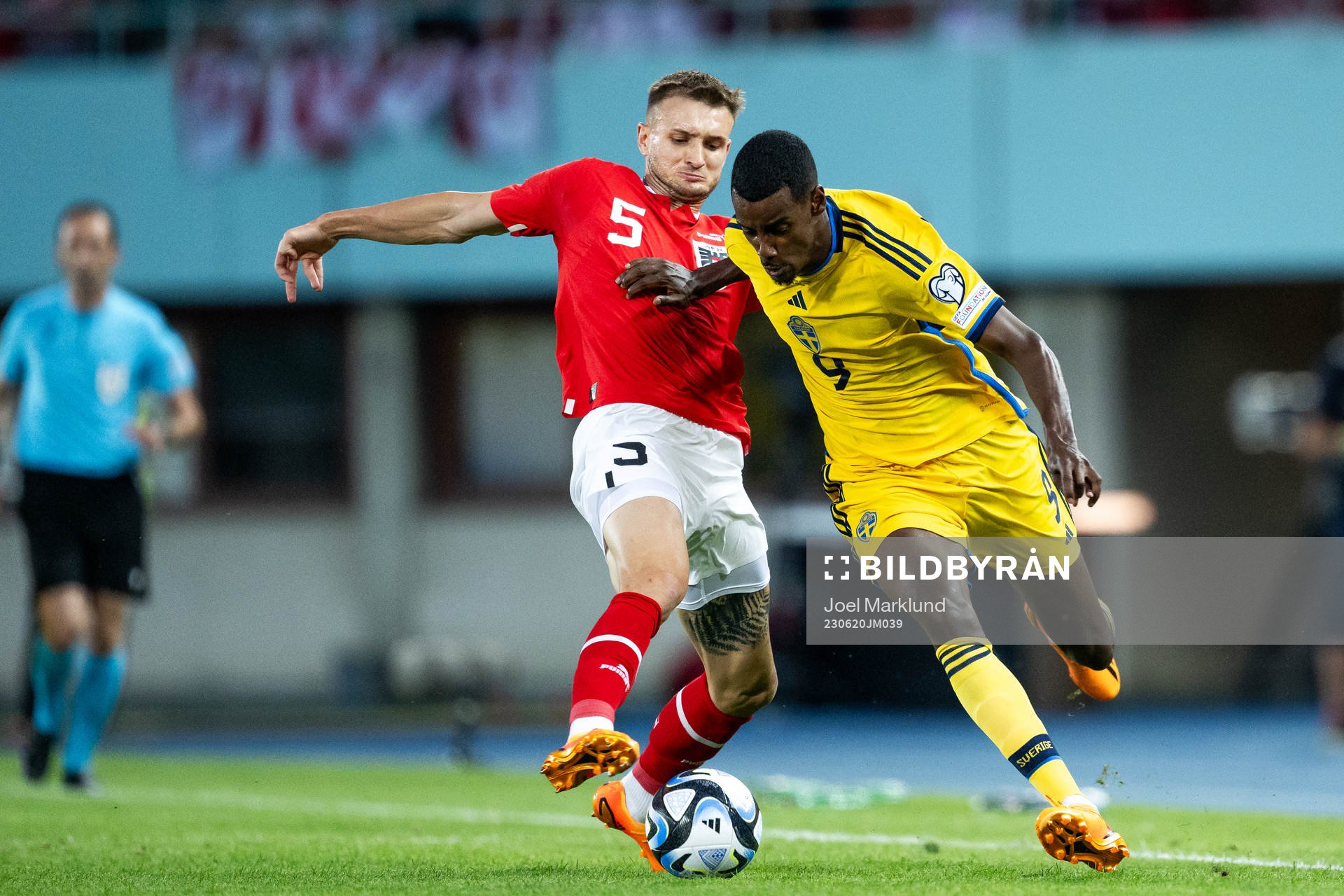 Stefan Posch of Austria and Alexander Isak of Sweden