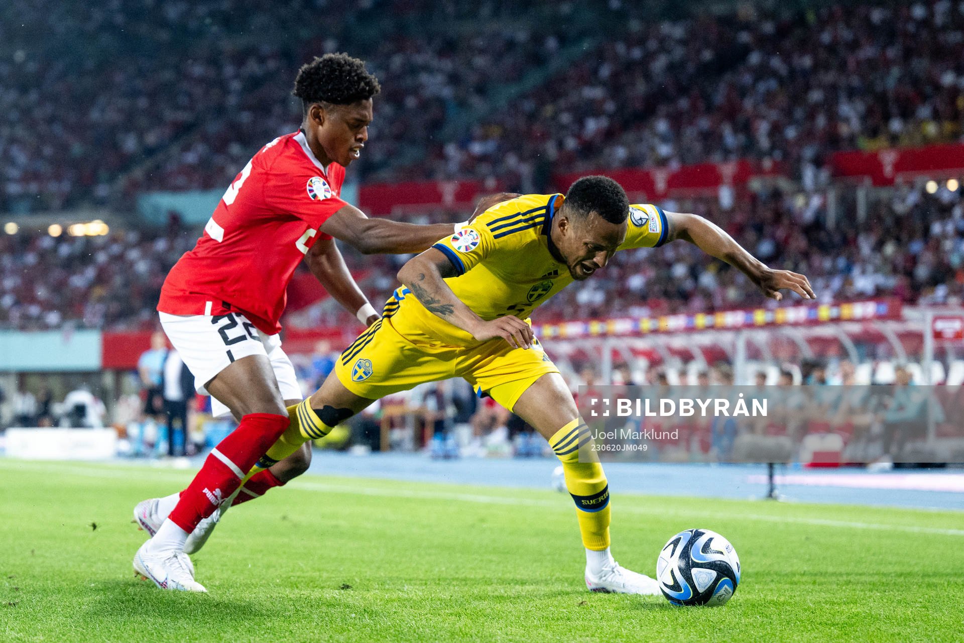Junior Adamu of Austria and Martin Olsson of Sweden