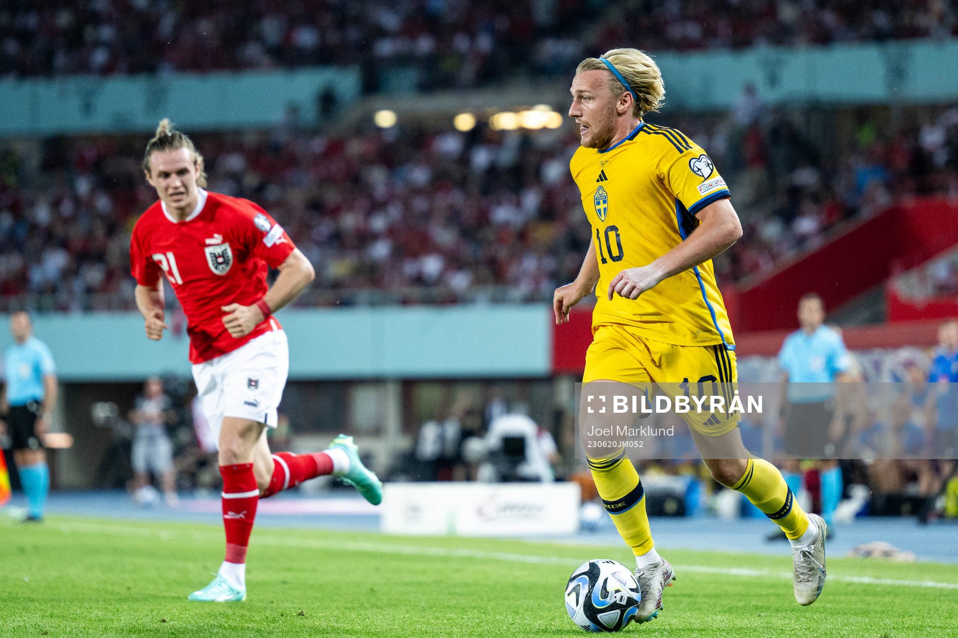 Patrick Wimmer of Austria and Emil Forsberg of Sweden