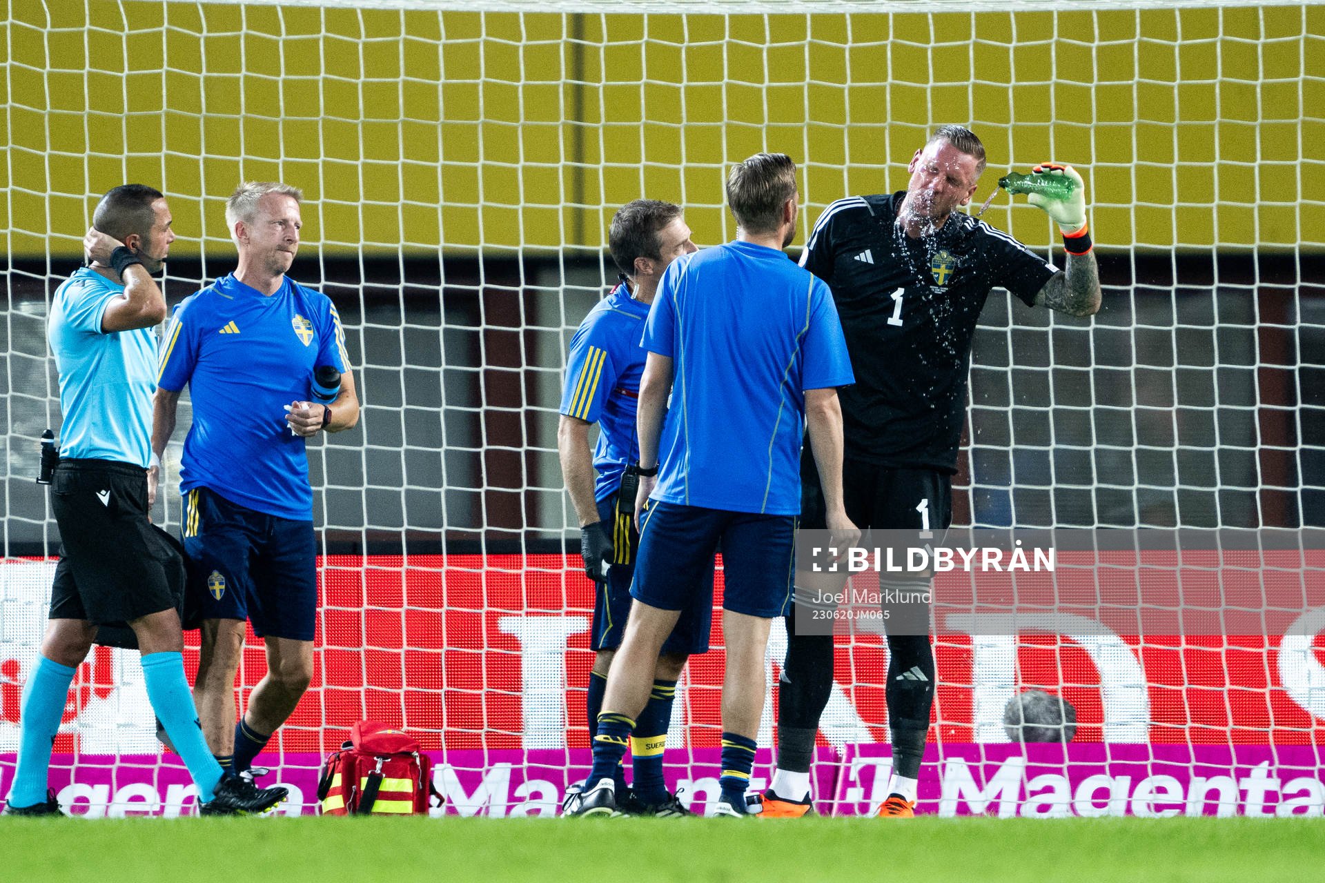 Goalkeeper Robin Olsen of Sweden receives medical attention