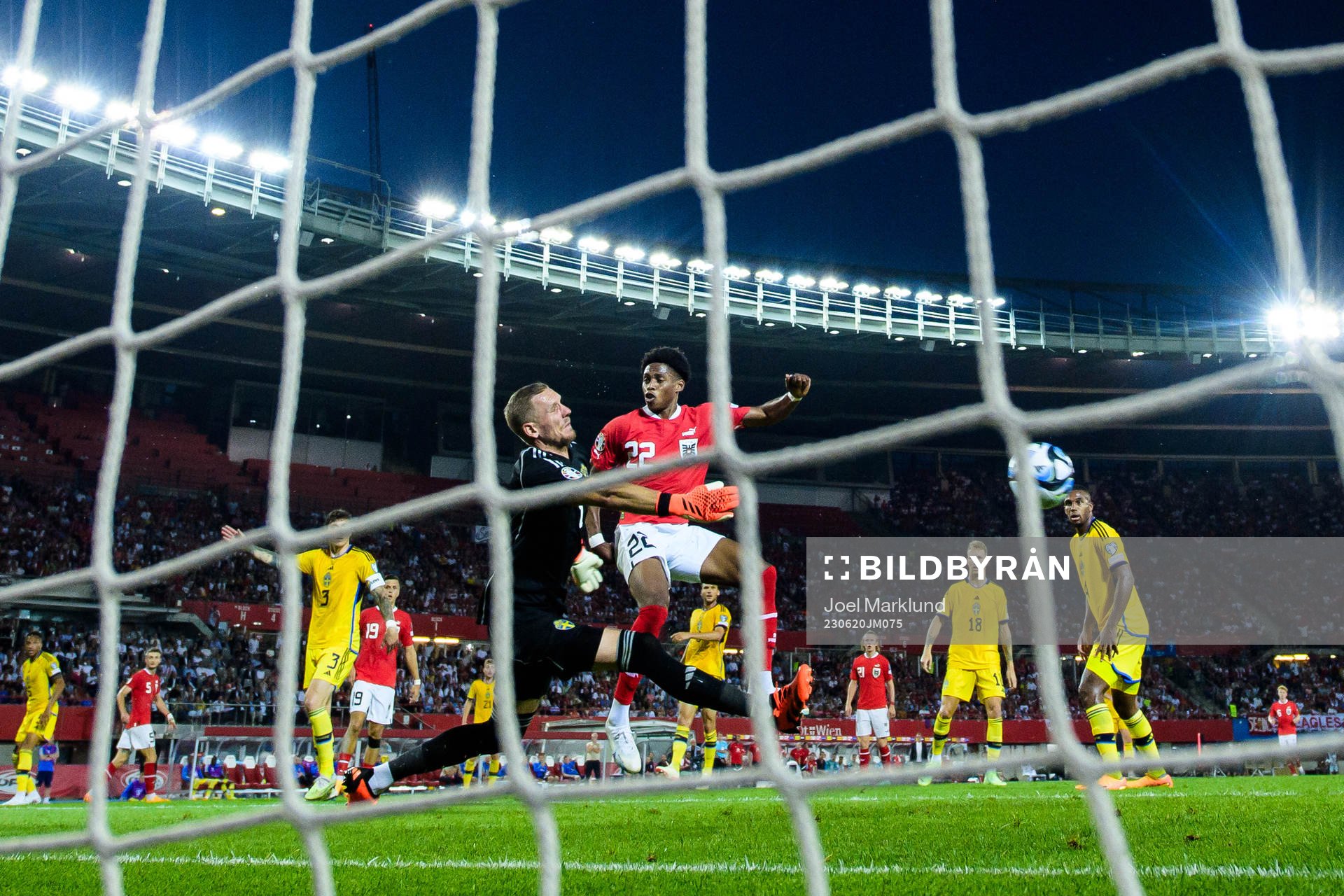 Goalkeeper Robin Olsen of Sweden and Junior Adamu of Austria during the UEFA Euro Qualifier football match between Austria and Sweden on June 20, 2023 in Vienna.