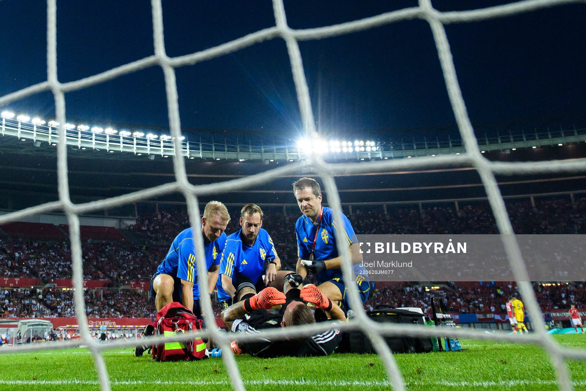 Goalkeeper Robin Olsen of Sweden gets medical treatment