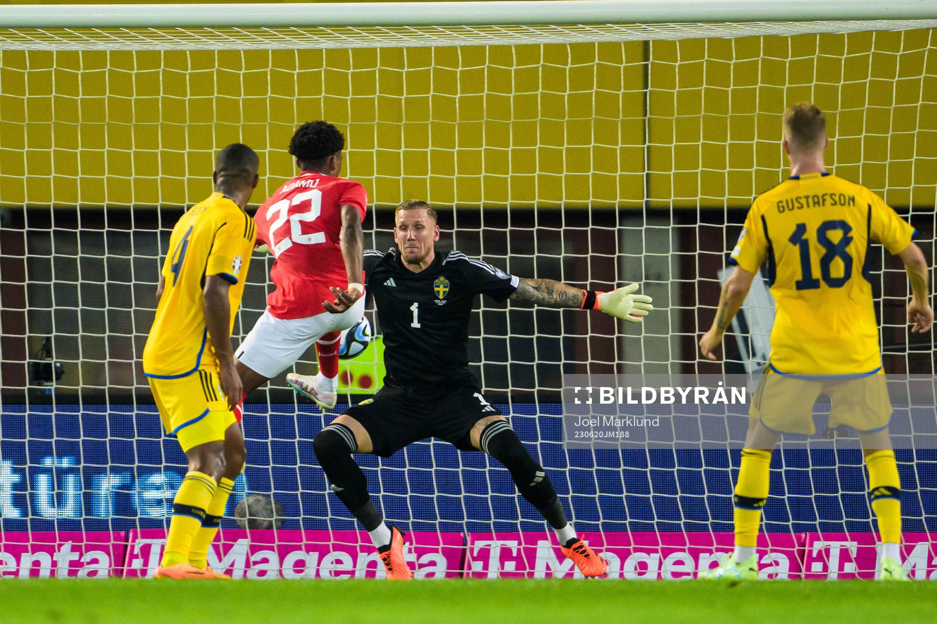 Junior Adamu of Austria and goalkeeper Robin Olsen of Sweden during the UEFA Euro Qualifier football match between Austria and Sweden on June 20, 2023 in Vienna.