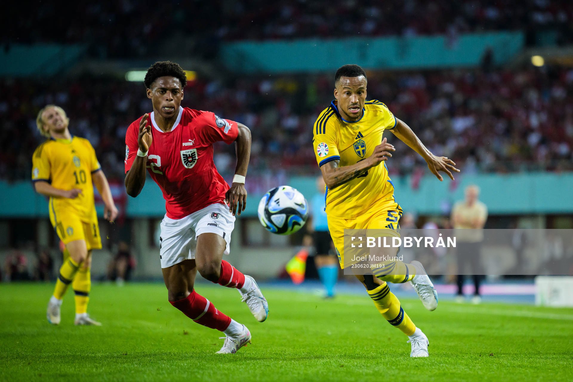 Junior Adamu of Austria and Martin Olsson of Sweden