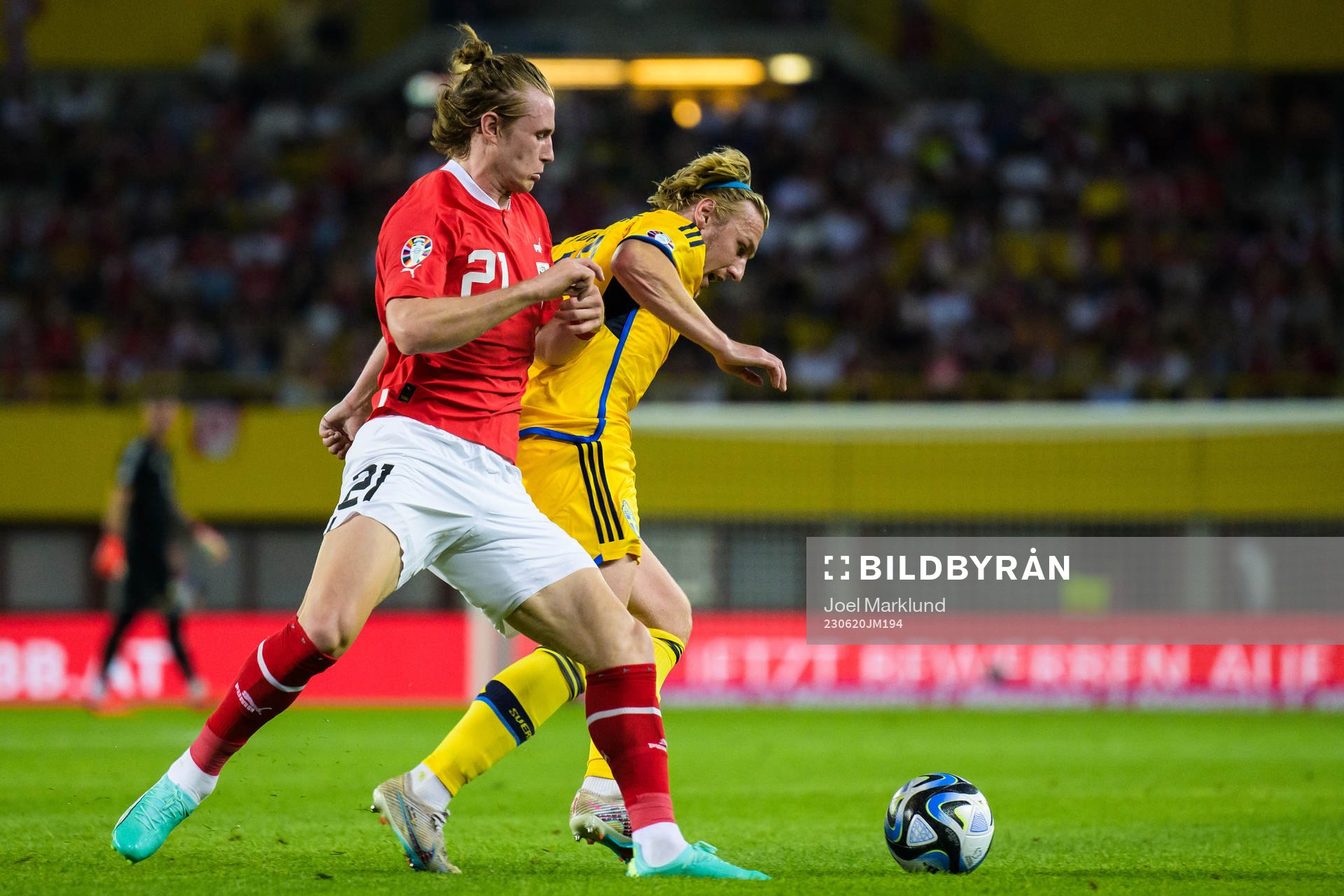 Patrick Wimmer of Austria and Emil Forsberg of Sweden