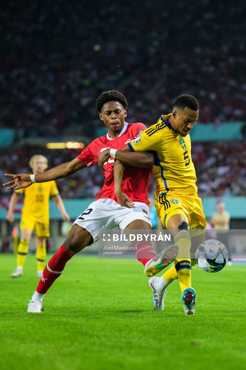 Junior Adamu of Austria and Martin Olsson of Sweden during the UEFA Euro Qualifier football match between Austria and Sweden on June 20, 2023 in Vienna.