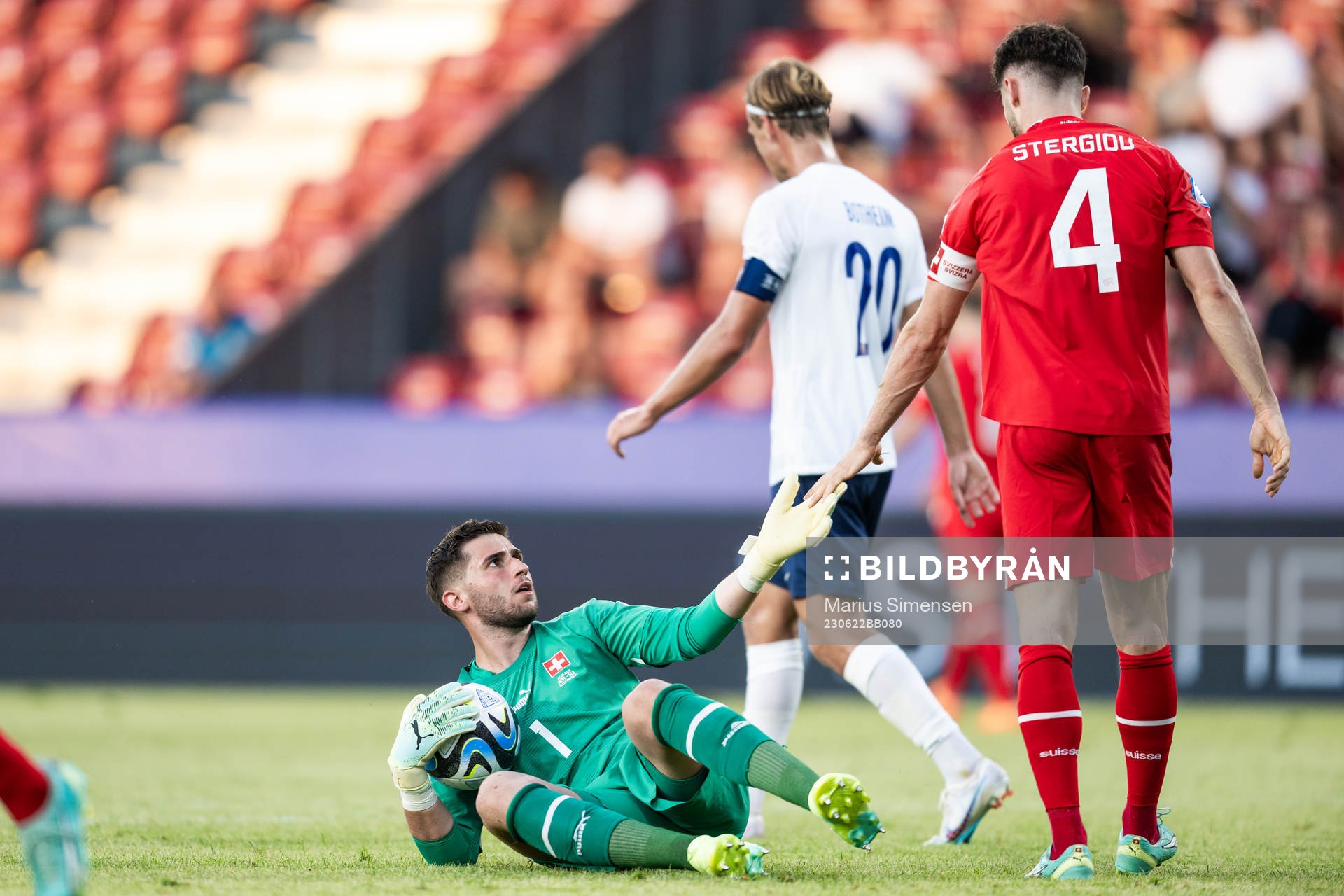 Goalkeeper Amir Saipi and Leonidas Stergiou of Switzerland