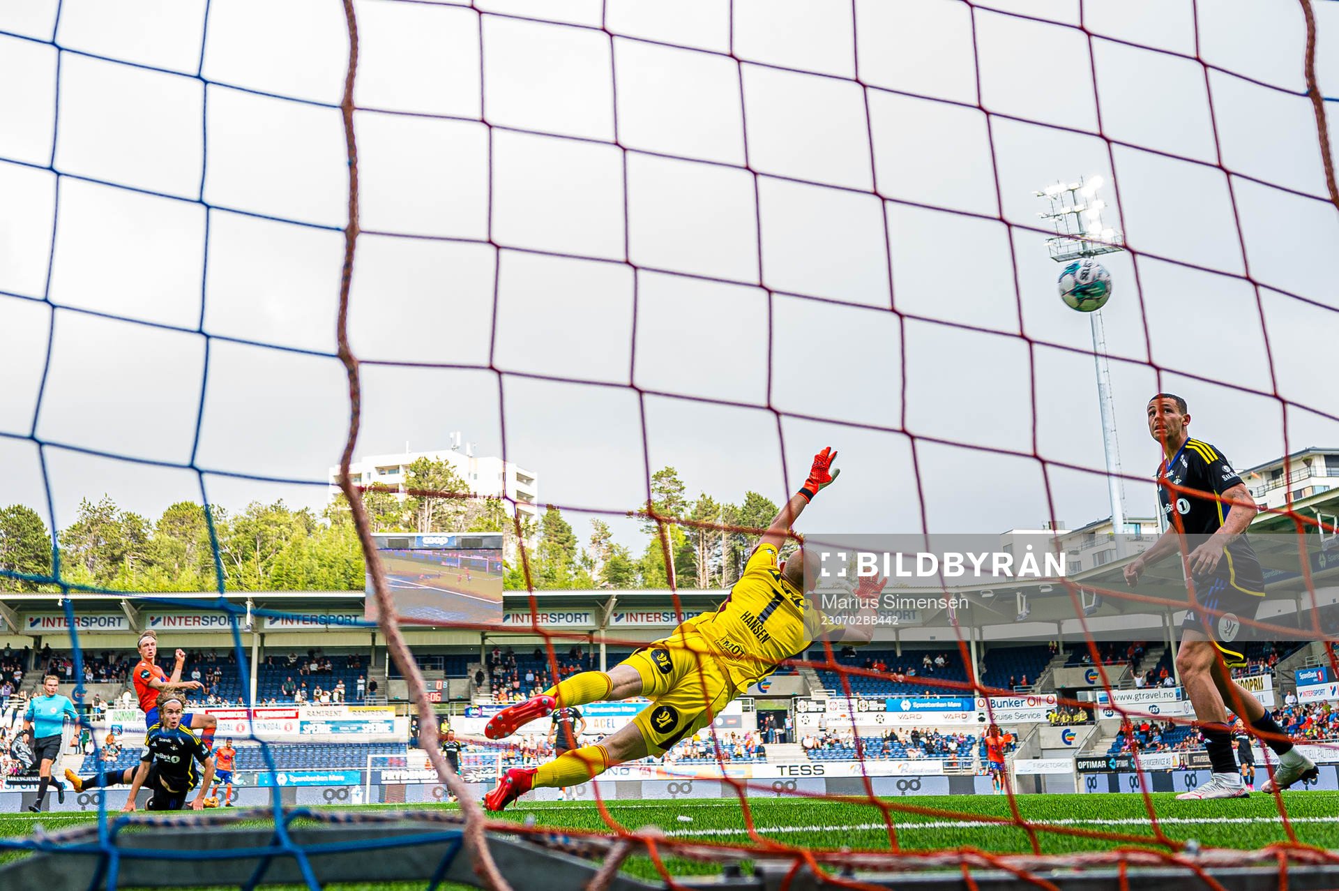 Markus Karlsbakk of Aalesund scores the 1-0 goal behind Andre Hansen of Rosenborg during the Eliteserien match between Aalesund and Rosenborg on July 2, 2023 in Ålesund.