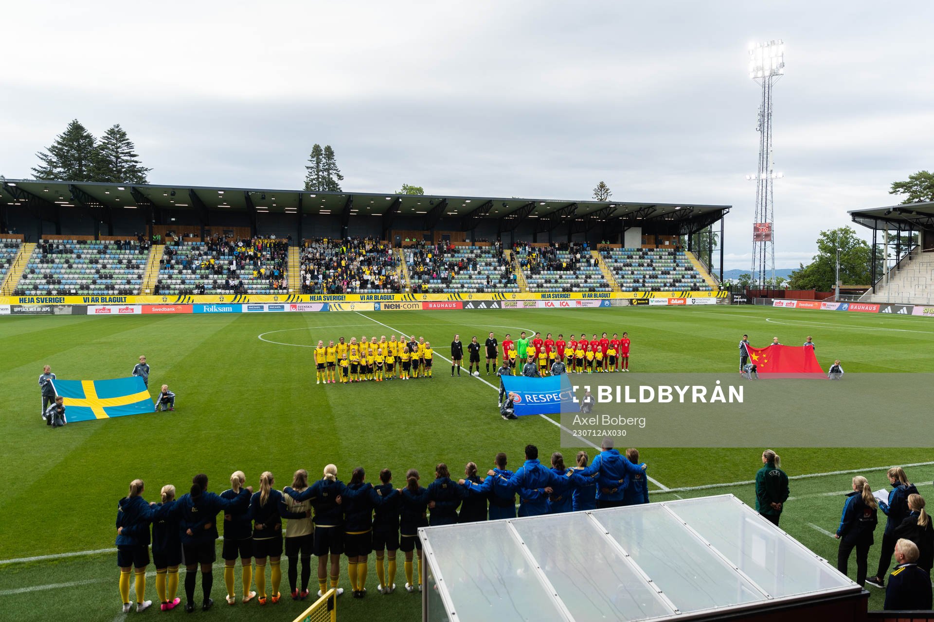 The teams stand