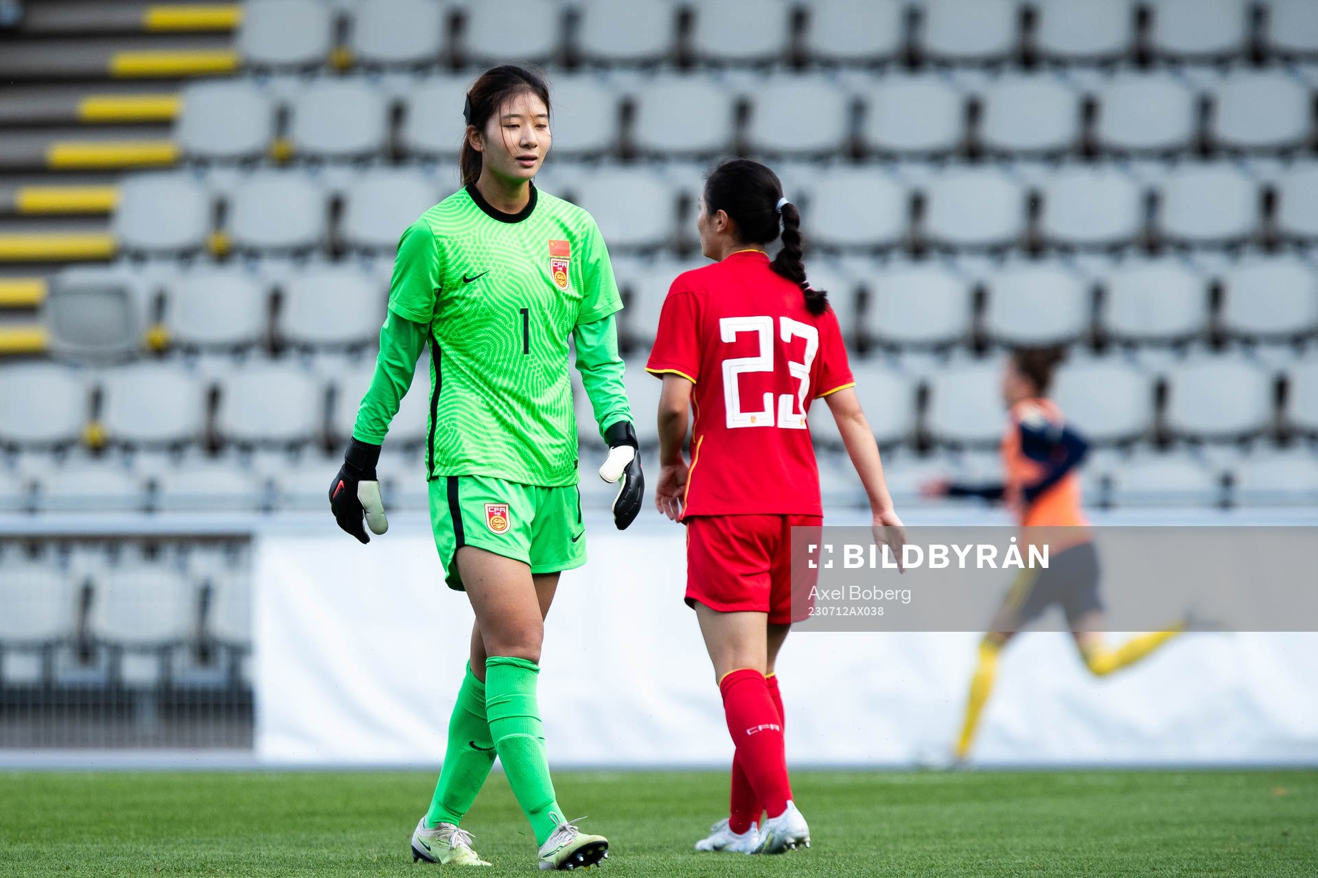 Goalkeeper Liu Chen of China looks dejected