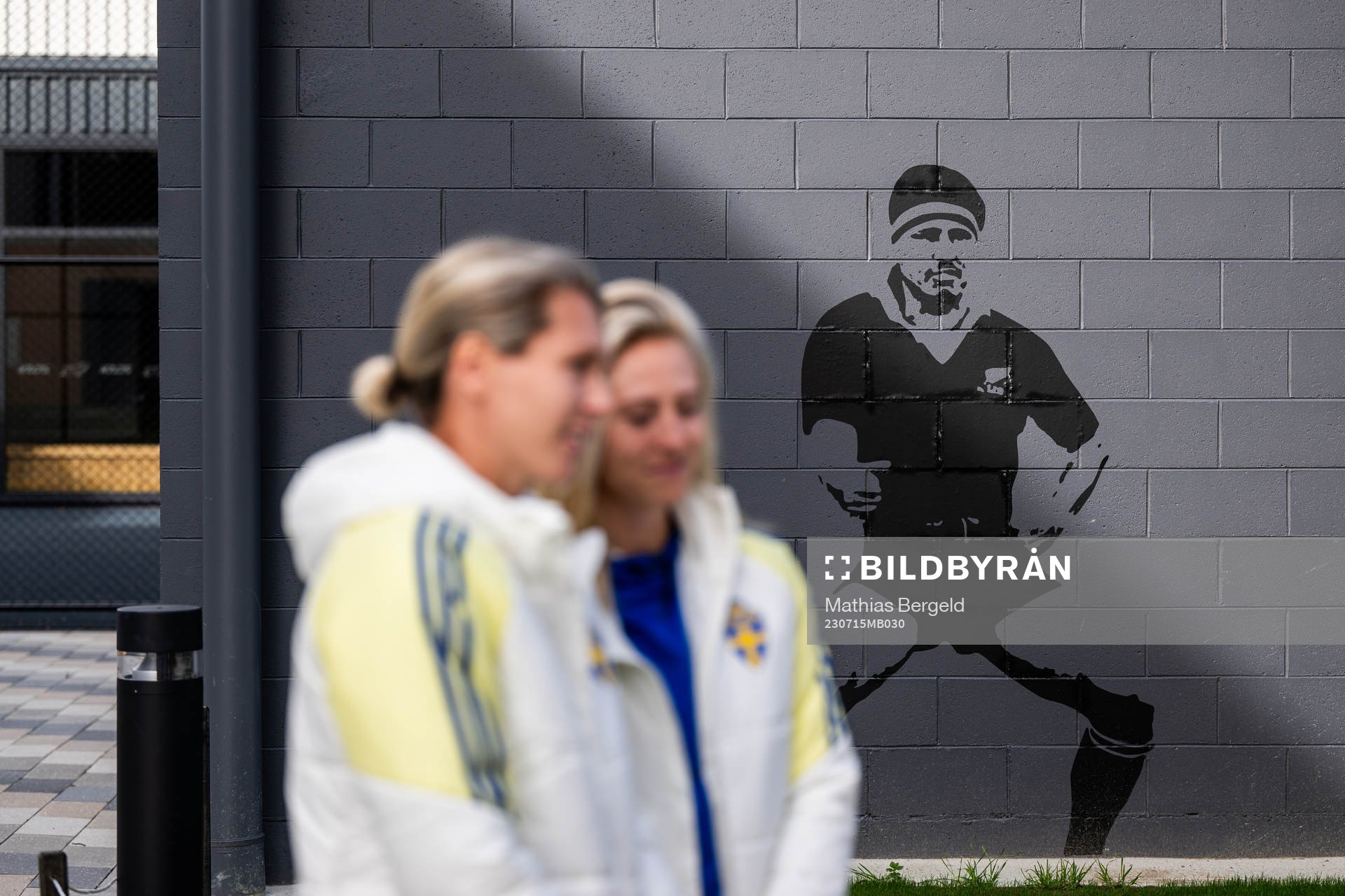 A mural displays a rugby player performing a Haka as