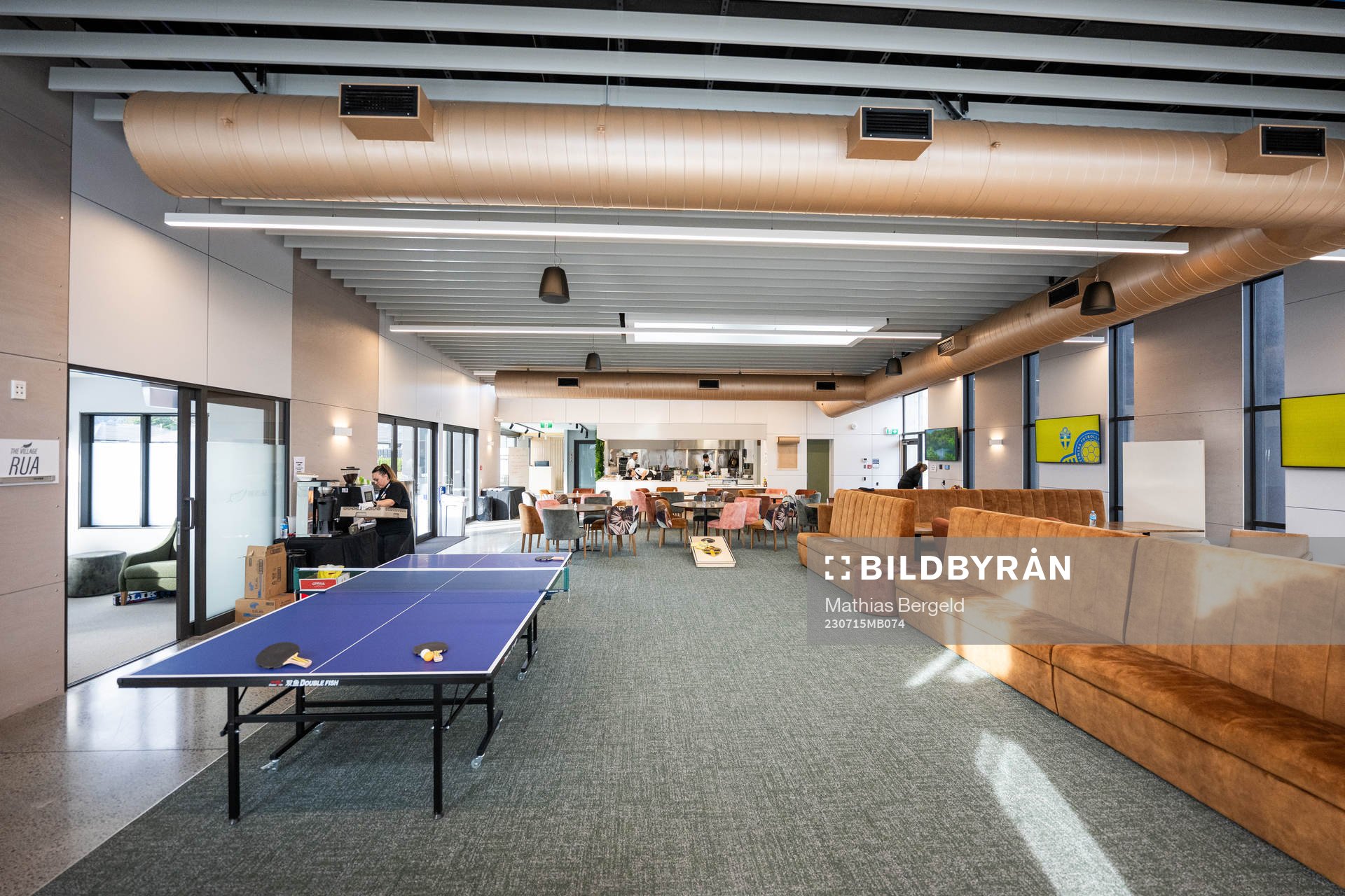 A table tennis table is seen in the eating and social area