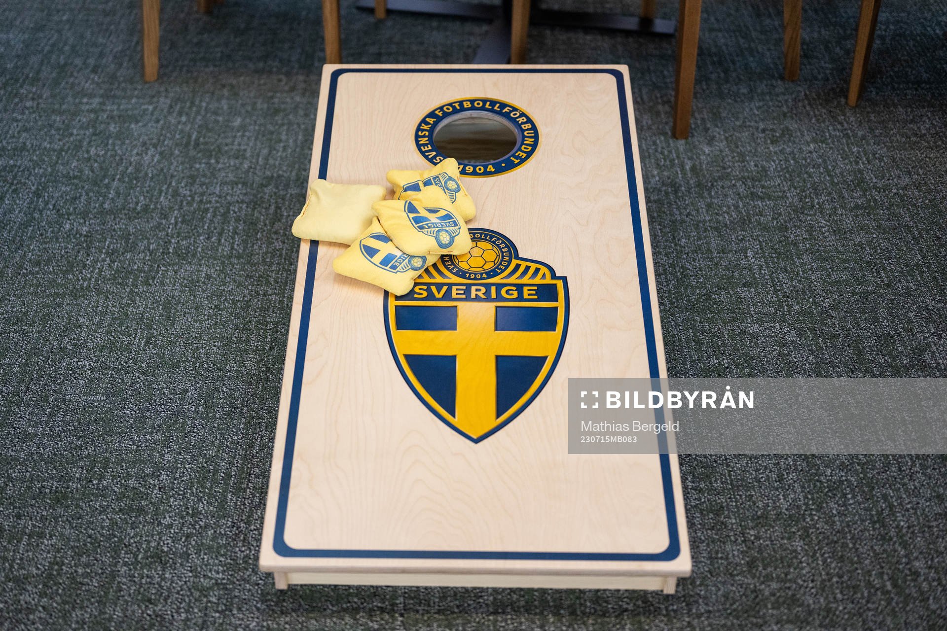 A cornhole game in the social area