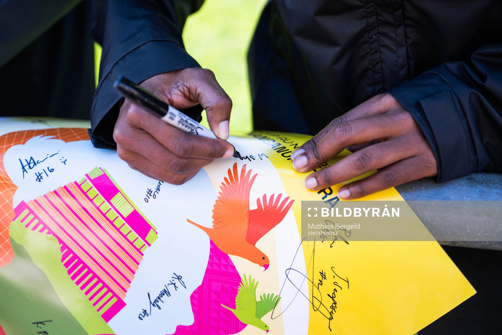 A player of the South African women's national football team signs a poster at a training session ahead of the FIFA Women's World Cup on July 17, 2023 in Porirua.