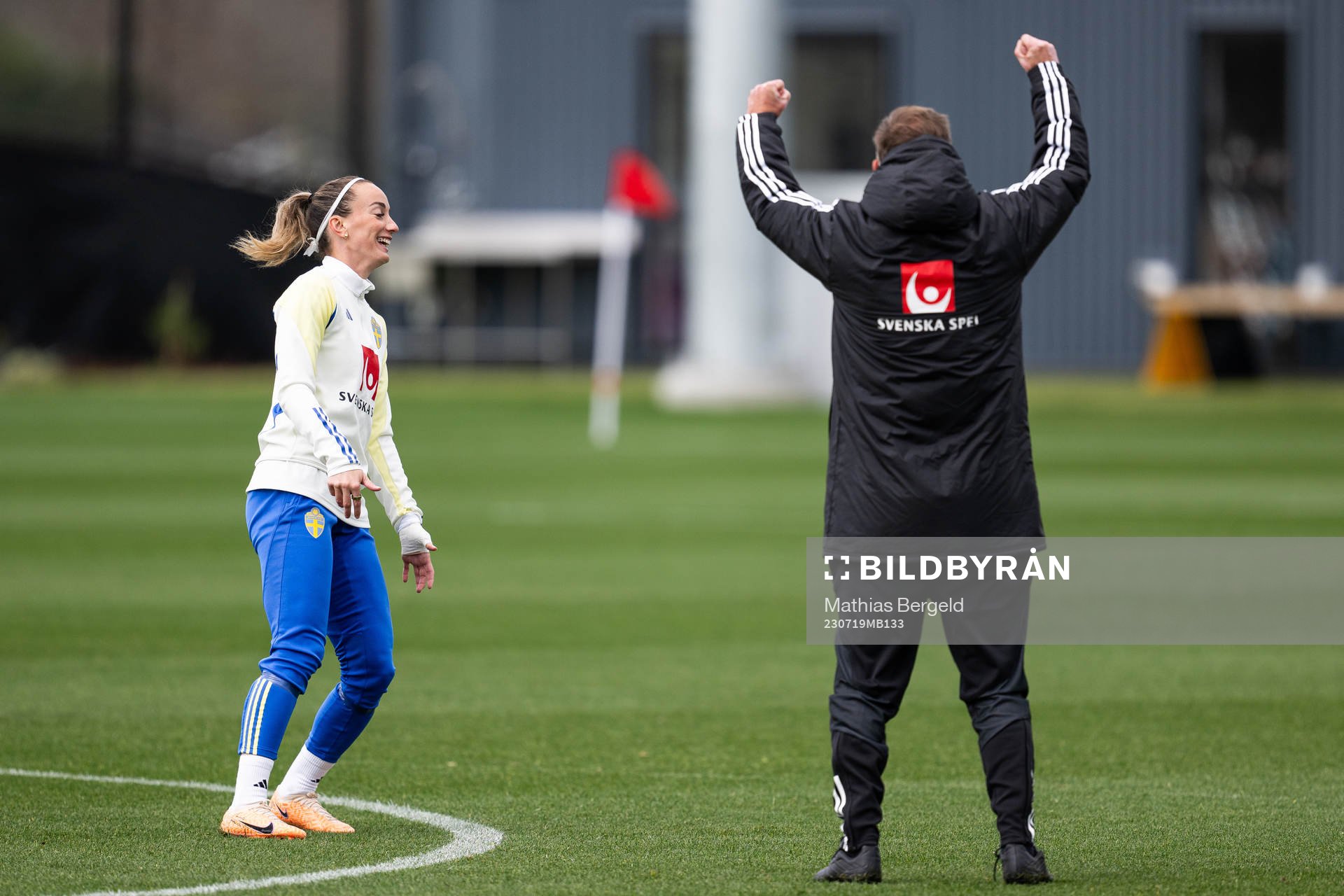 Head coach Peter Gerhardsson celebrates next to Kosovare Asllani of the Swedish women's national football team at a training session ahead of the FIFA Women's World Cup on July 19, 2023 in Upper Hutt.