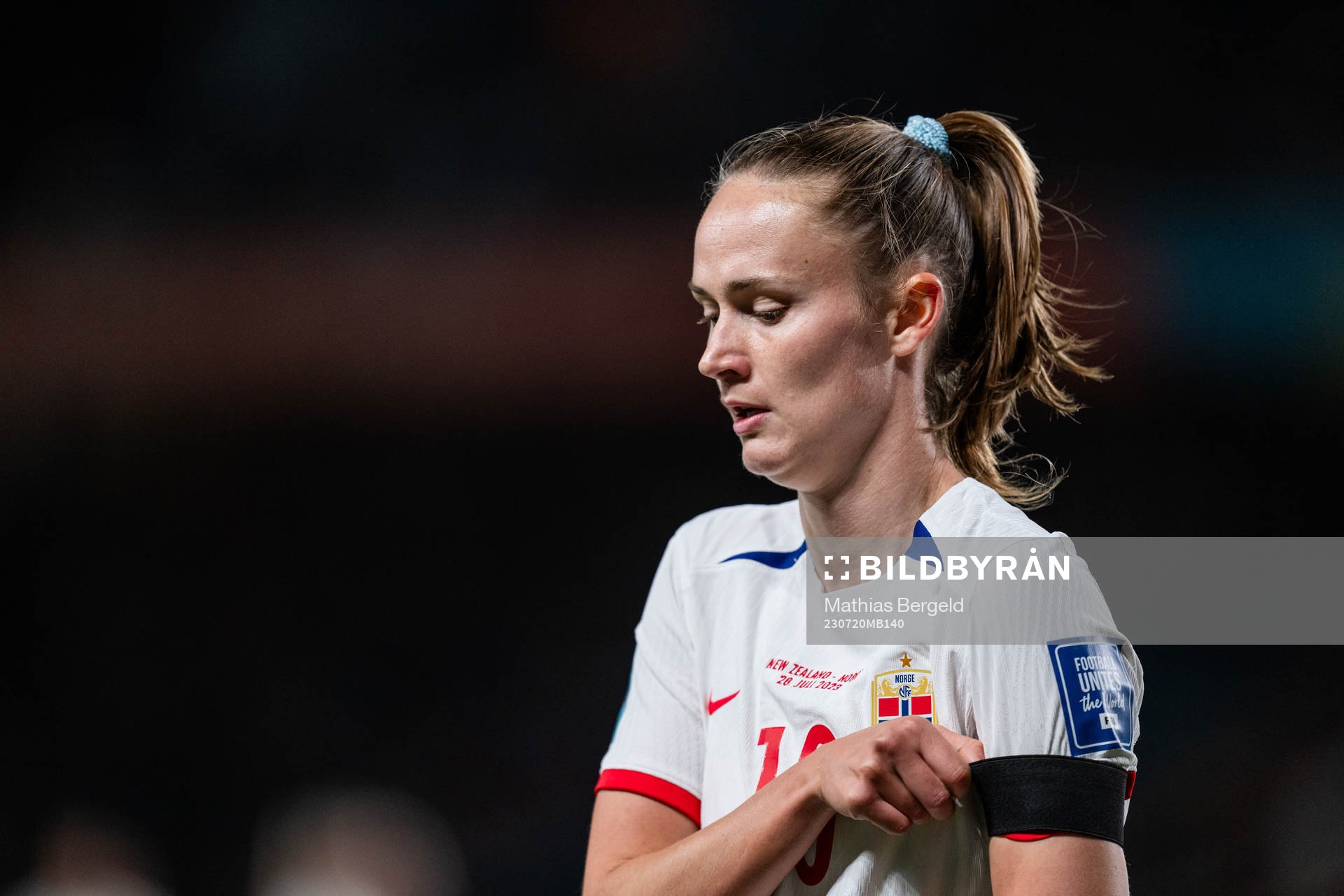 Caroline Graham Hansen of Norway pulls the black arm band,