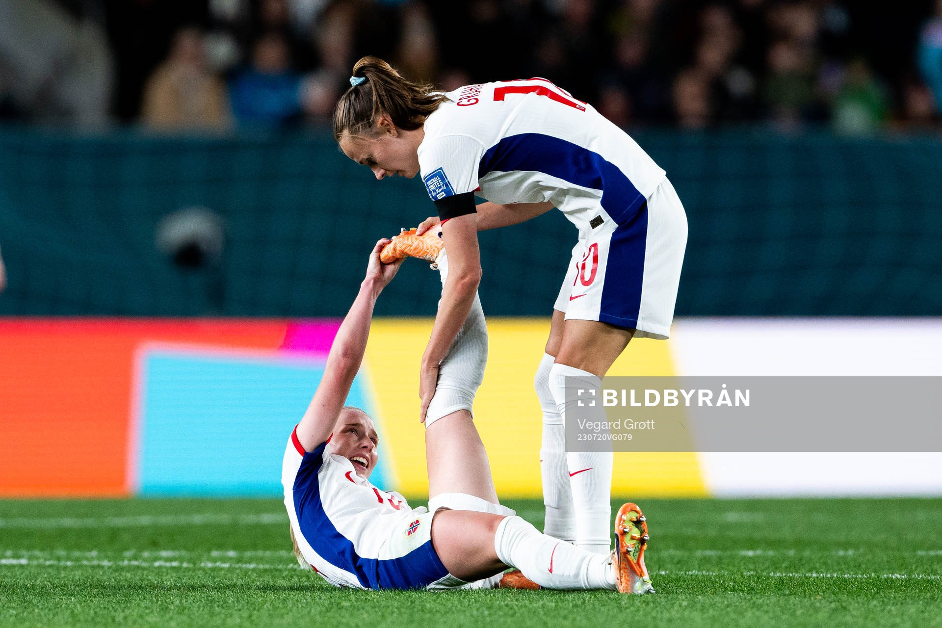 Thea Bjelde of Norway in pain and Caroline Graham Hansen of
