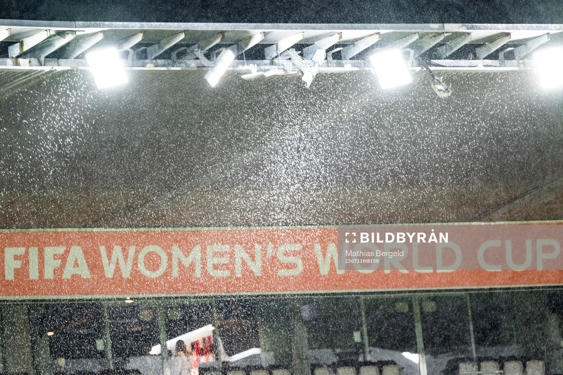 The text ”FIFA Women’s World Cup” is seen through rain